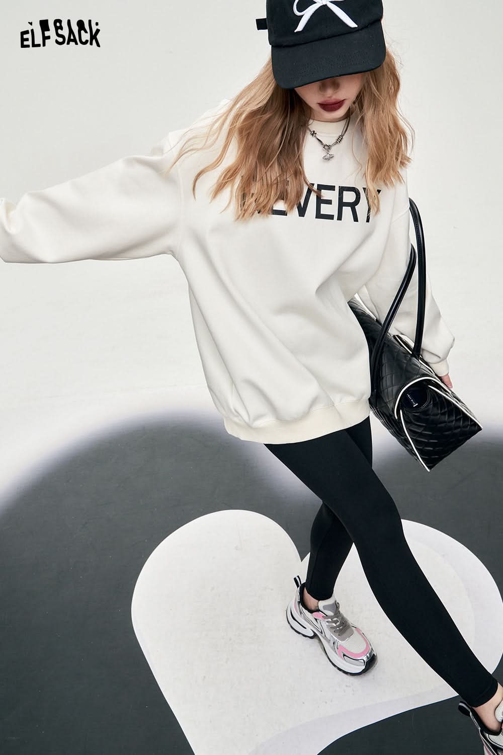 ELFSACK backless white large bow alphabet pringitng women's t-shirt long sleeve crew neck sweet office style loose top