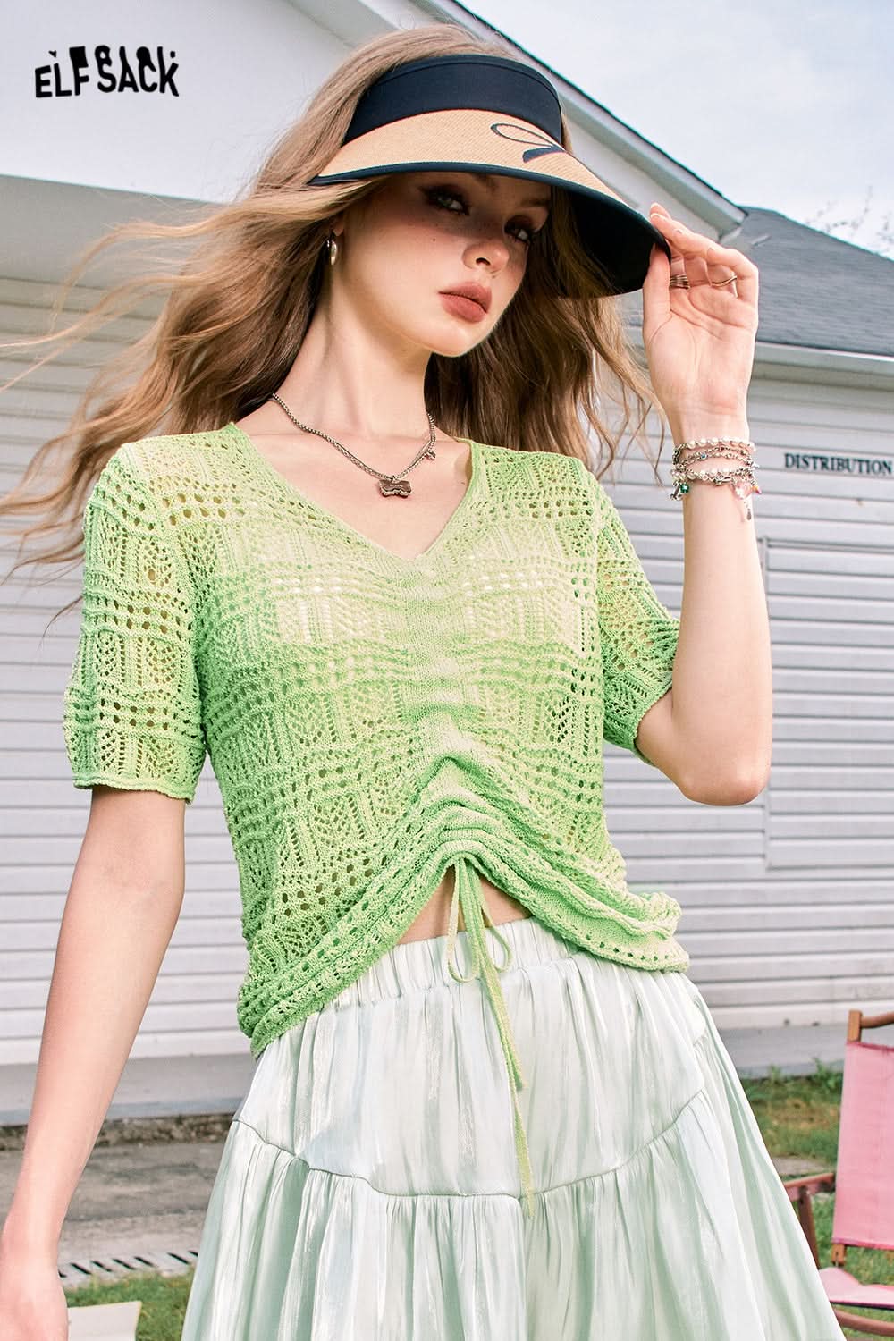 ELFSACK Hollow pleated ice curve breathable sweet and gentle style short-sleeved knitted sweater