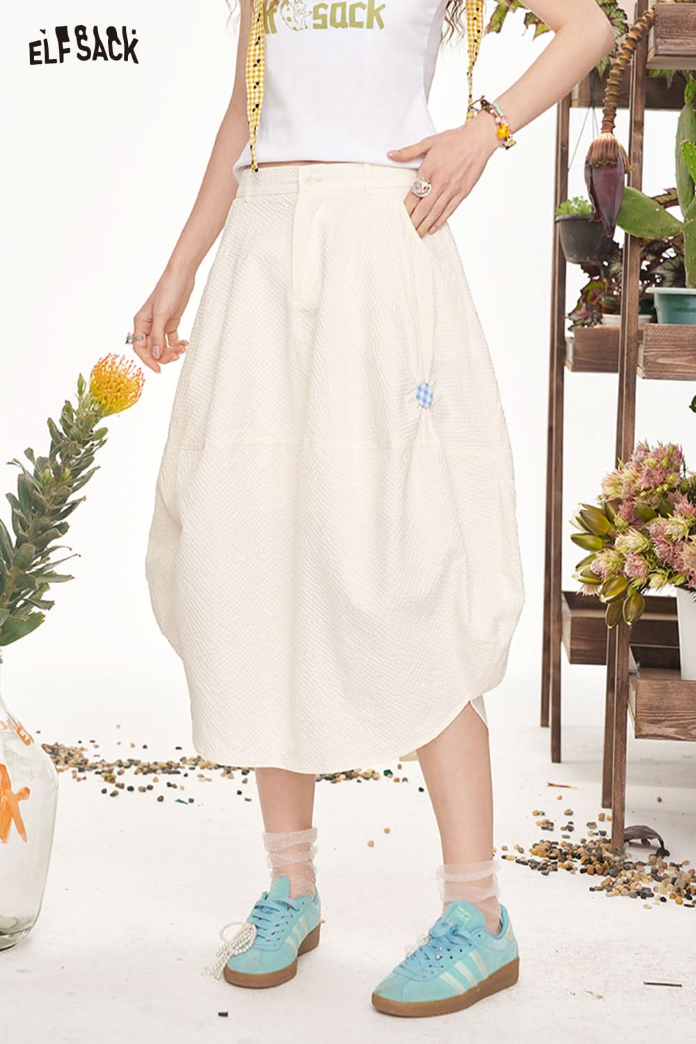 ELFSACK Irregular Button Shaped Half Length Casual Long Skirt