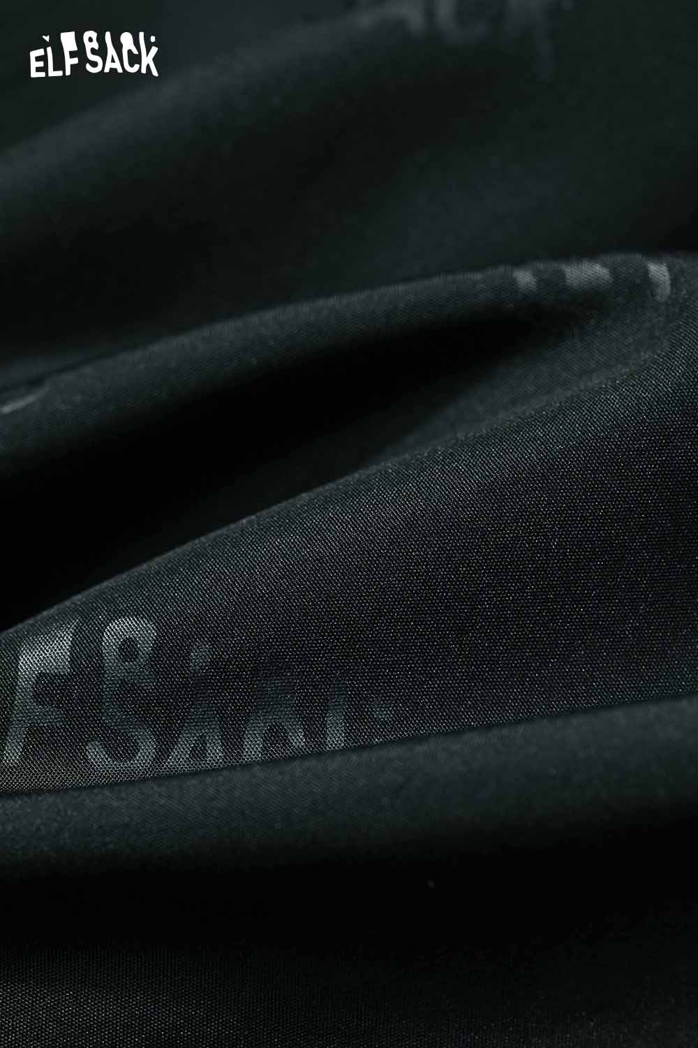 Close-up of a minimalist long coat for women by ELFSACK, showcasing smooth wool fabric texture