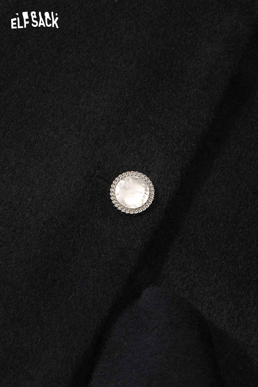 Close-up of ELFSACK black minimalist long coat for women featuring a stylish decorative button