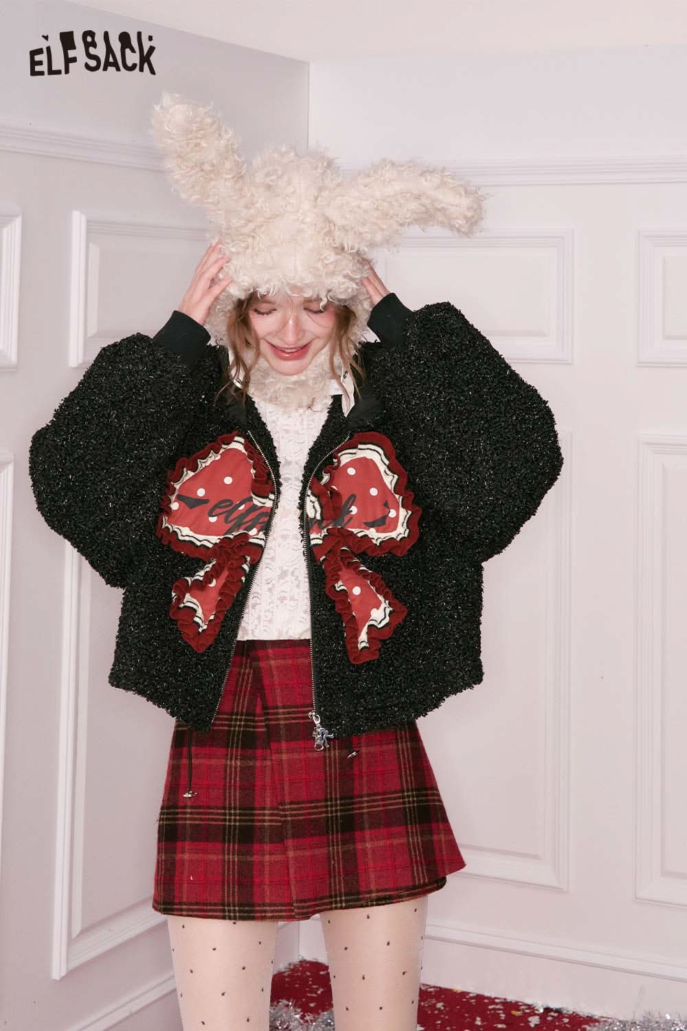 ELFSACK 3D bow glitter plush jacket in black with a playful design, perfect for winter fashion