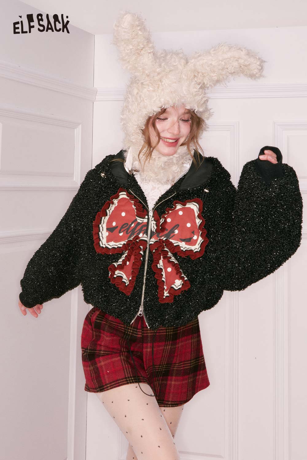 ELFSACK 3D bow glitter plush jacket with oversized sleeves and playful design for cozy style