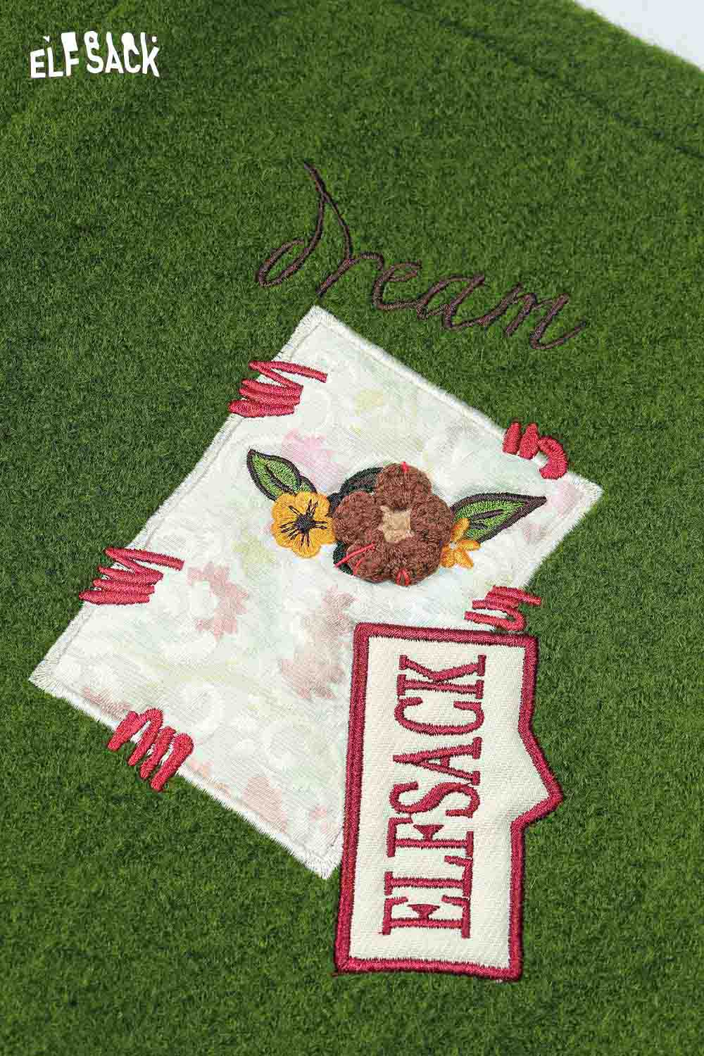 Close-up of an ELFSACK 3D embellished hooded coat for women featuring intricate embroidery and floral design