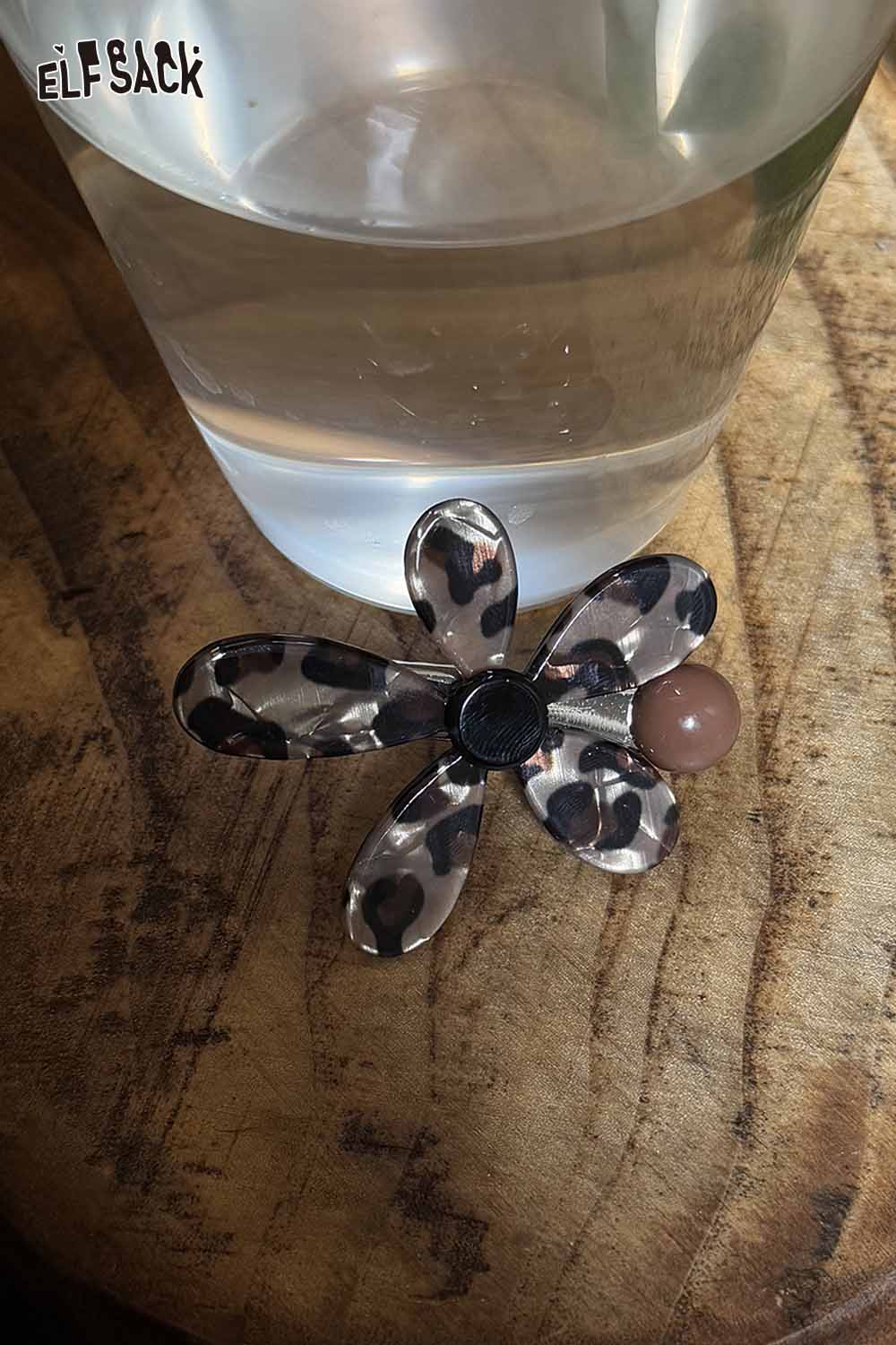 ELFSACK asymmetric floral hairpin with a leopard print design and a round bead accent
