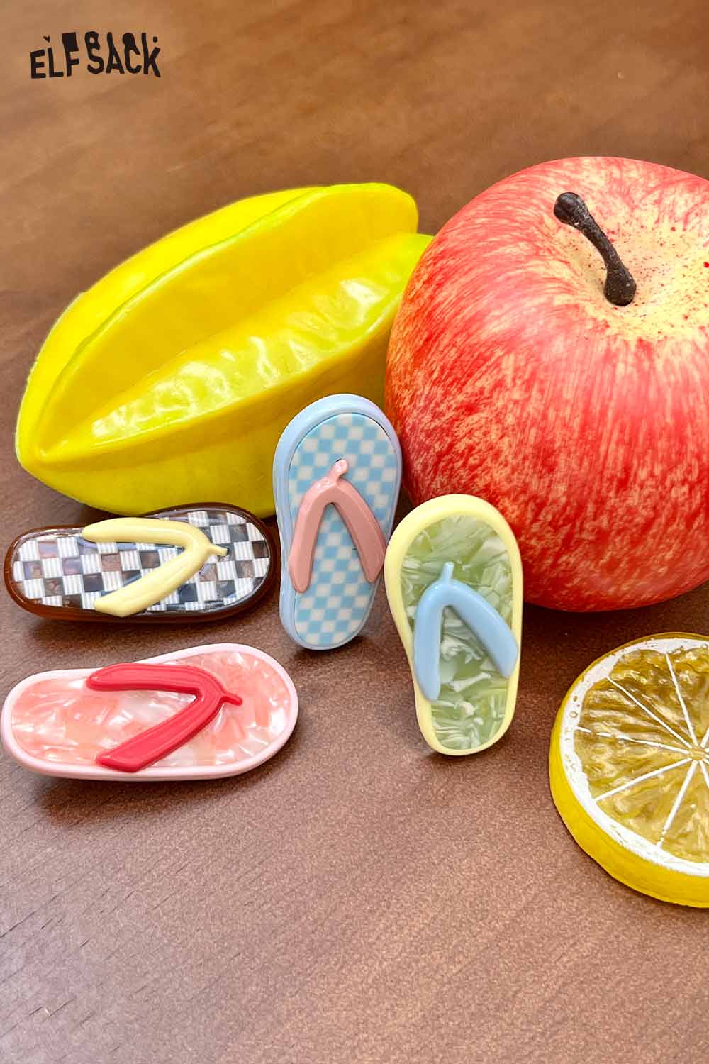 ELFSACK korean cute hair clip set of colorful flip flop resin barrettes displayed with apple and lemon slice