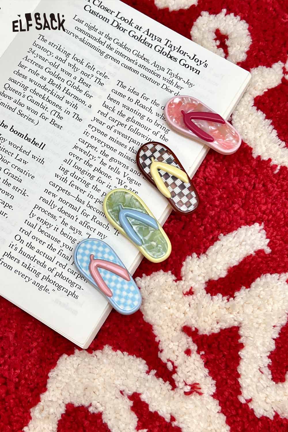 ELFSACK korean cute hair clip set of four flip flop shaped pastel patterned clips on magazine and red rug