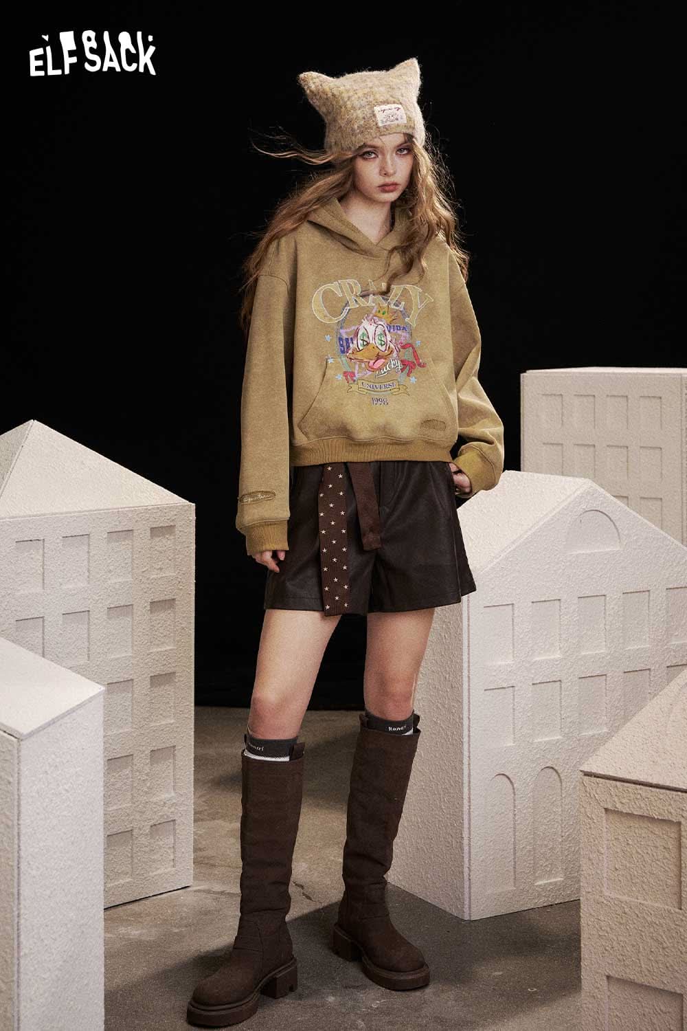 ELFSACK animal graphic cropped sweatshirt in beige paired with a stylish skirt and knee-high boots