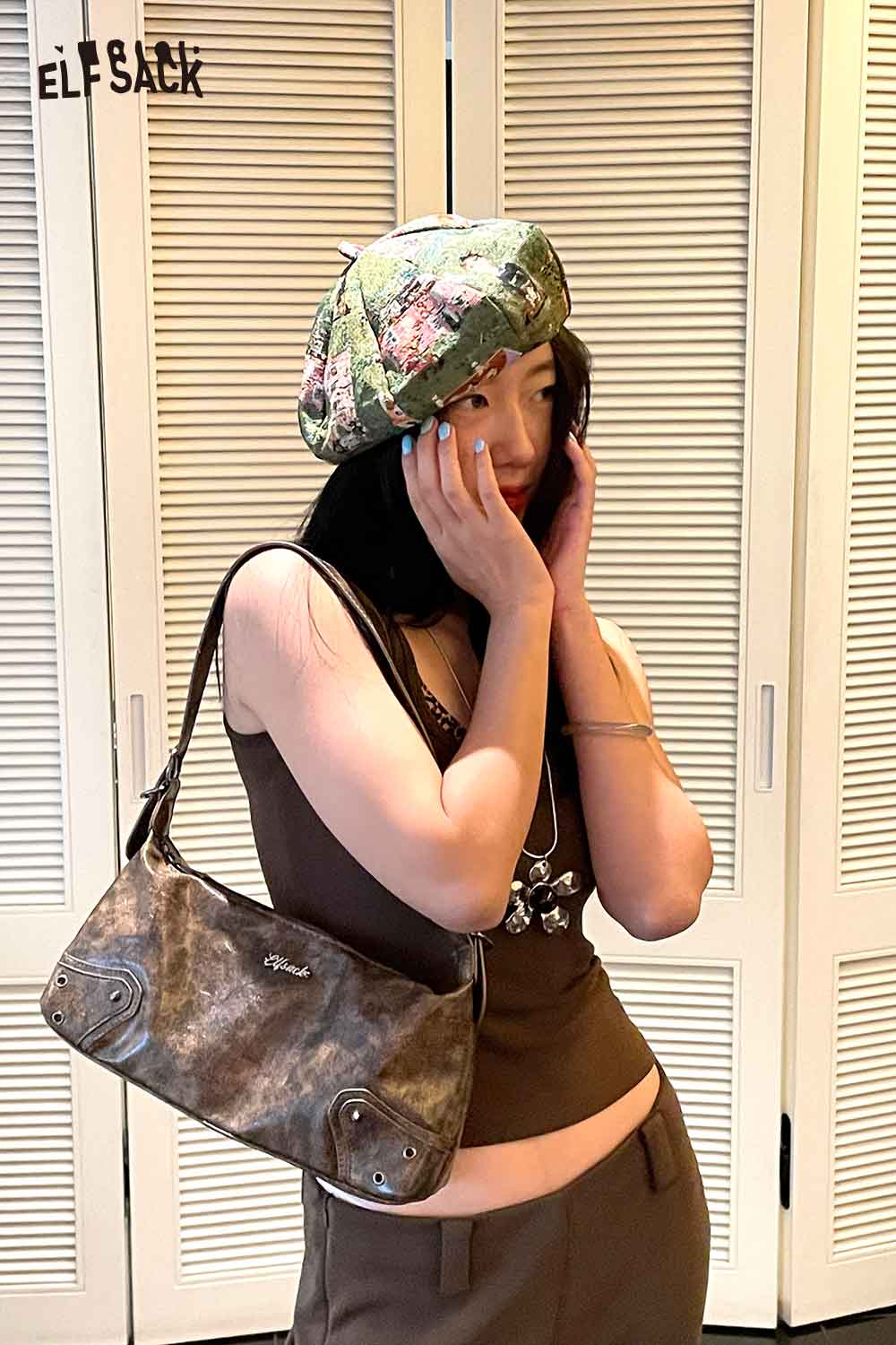 ELFSACK artist inspired beret for women featuring unique design, paired with a stylish top and bag