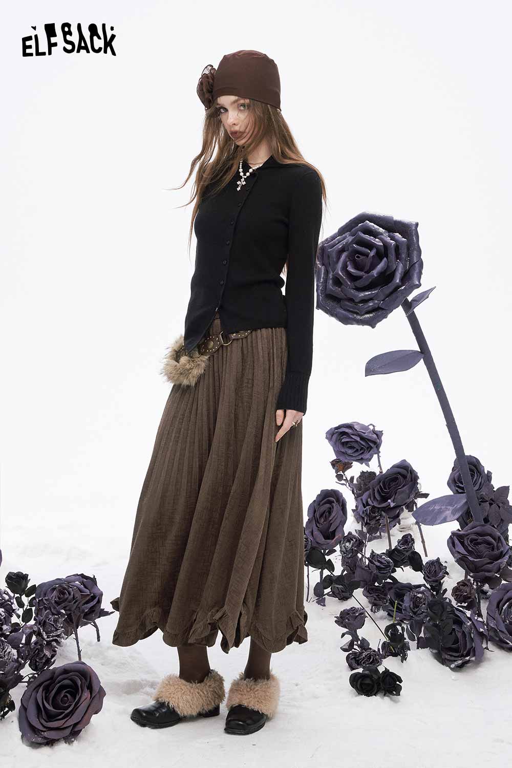 ELFSACK asymmetric flounce hem skirt in brown with pleats, styled with a black sweater and accessories