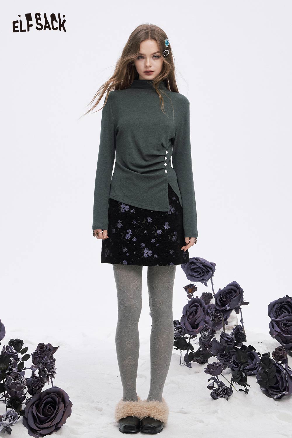 ELFSACK asymmetric hem long sleeve tshirt in green, styled with floral skirt and gray tights