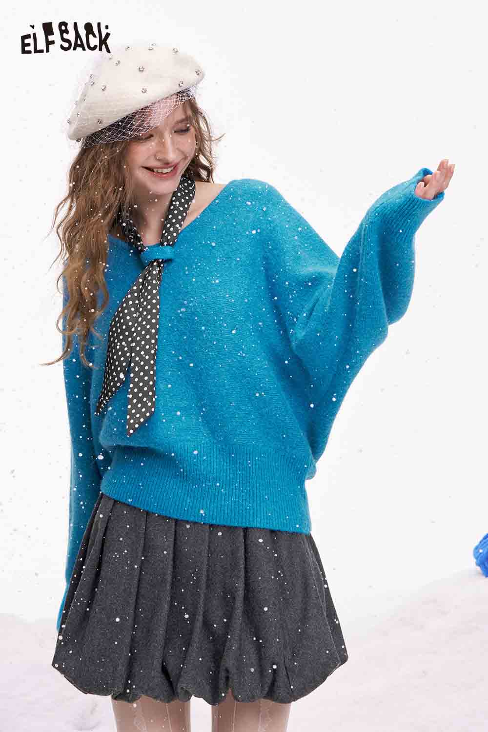 ELFSACK bat sleeve polka dot sweater in turquoise with a contrasting bow tie and stylish look