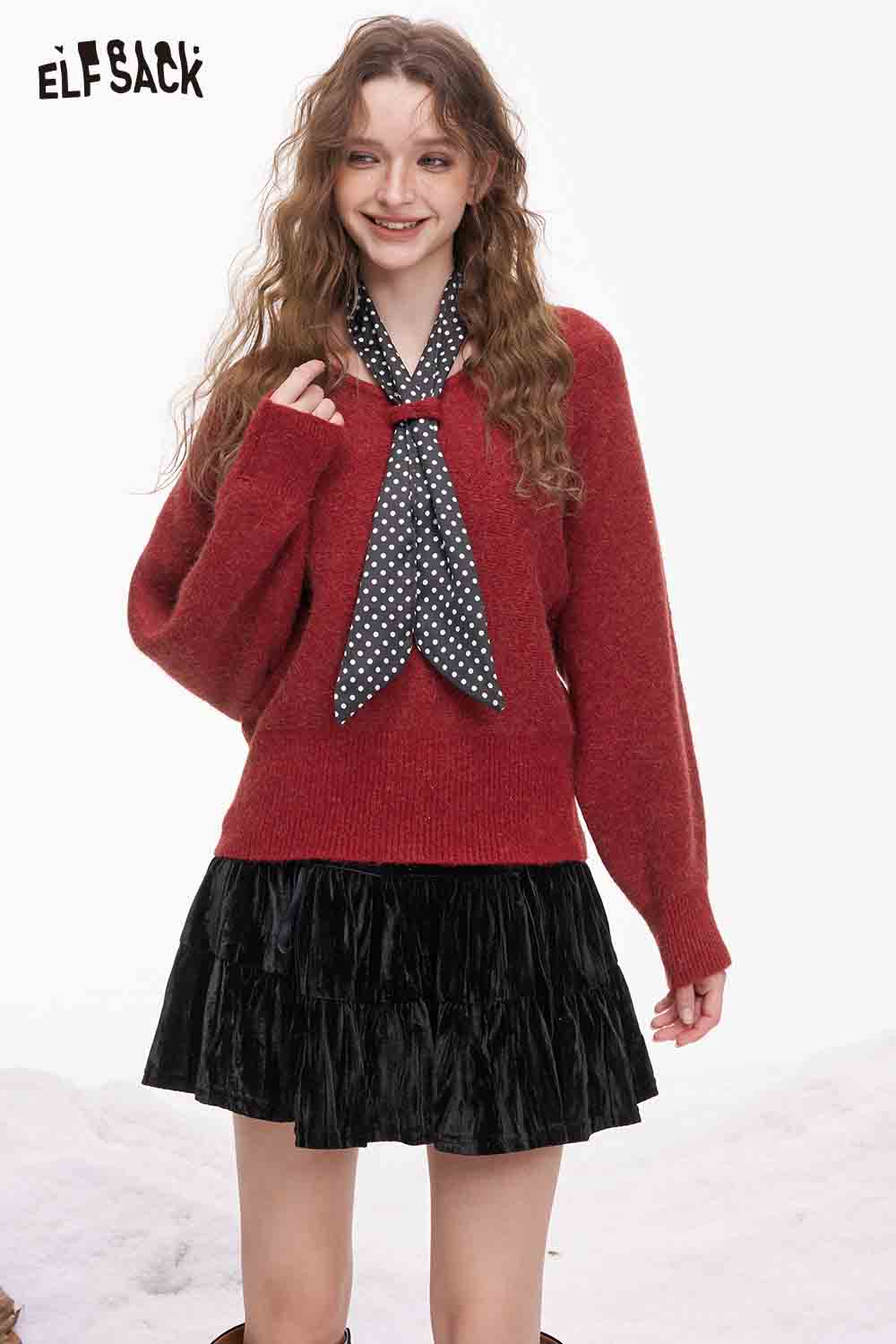 ELFSACK bat sleeve polka dot sweater in red paired with a black pleated skirt and polka dot tie