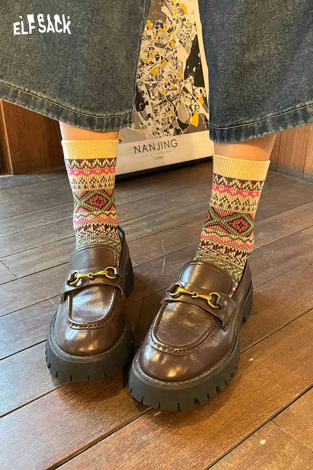 Stylish ELFSACK bohemian stripe socks for women worn with brown loafers and denim, showcasing a vibrant design