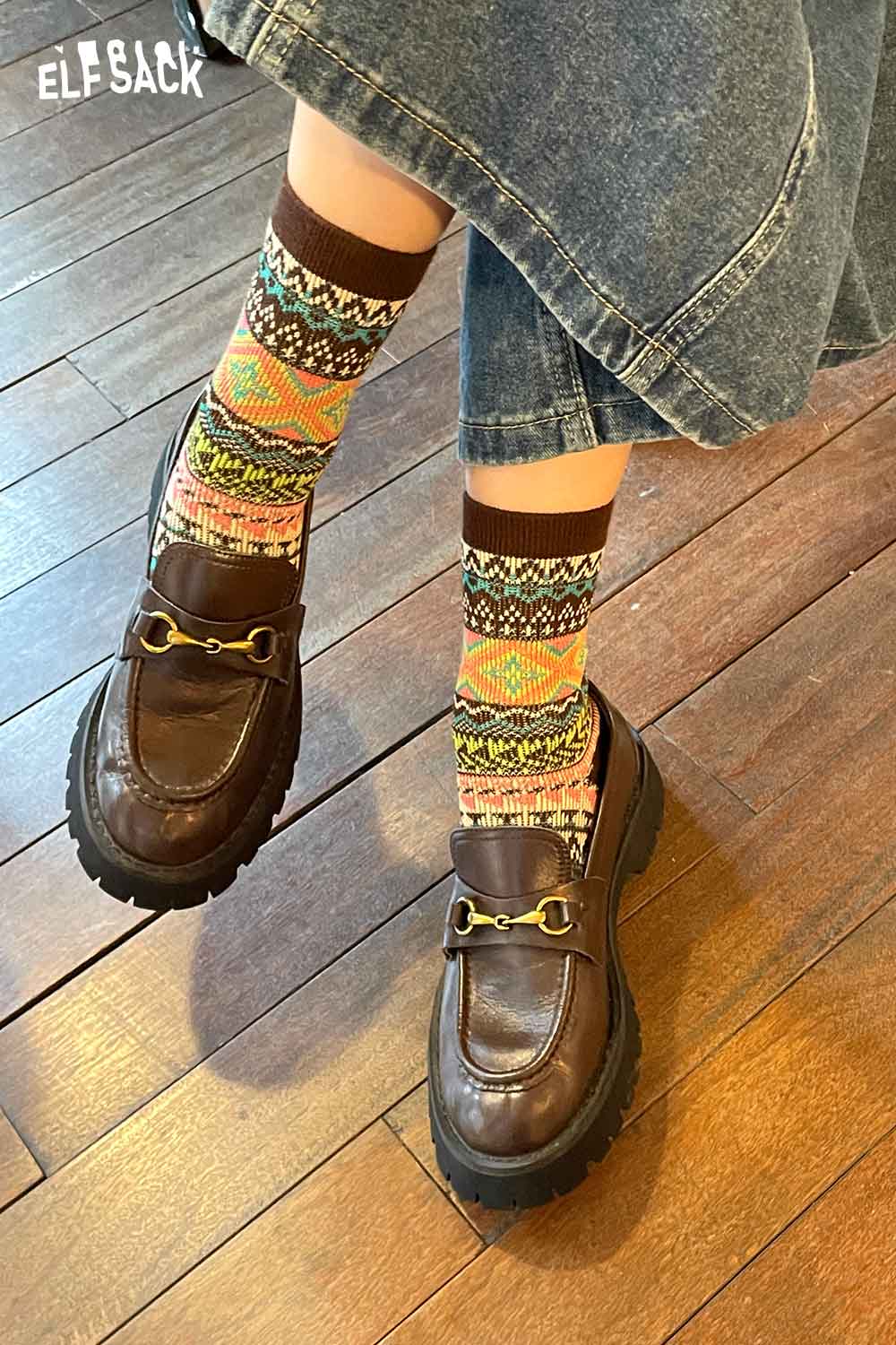 Colorful ELFSACK bohemian stripe socks for women paired with stylish brown loafers