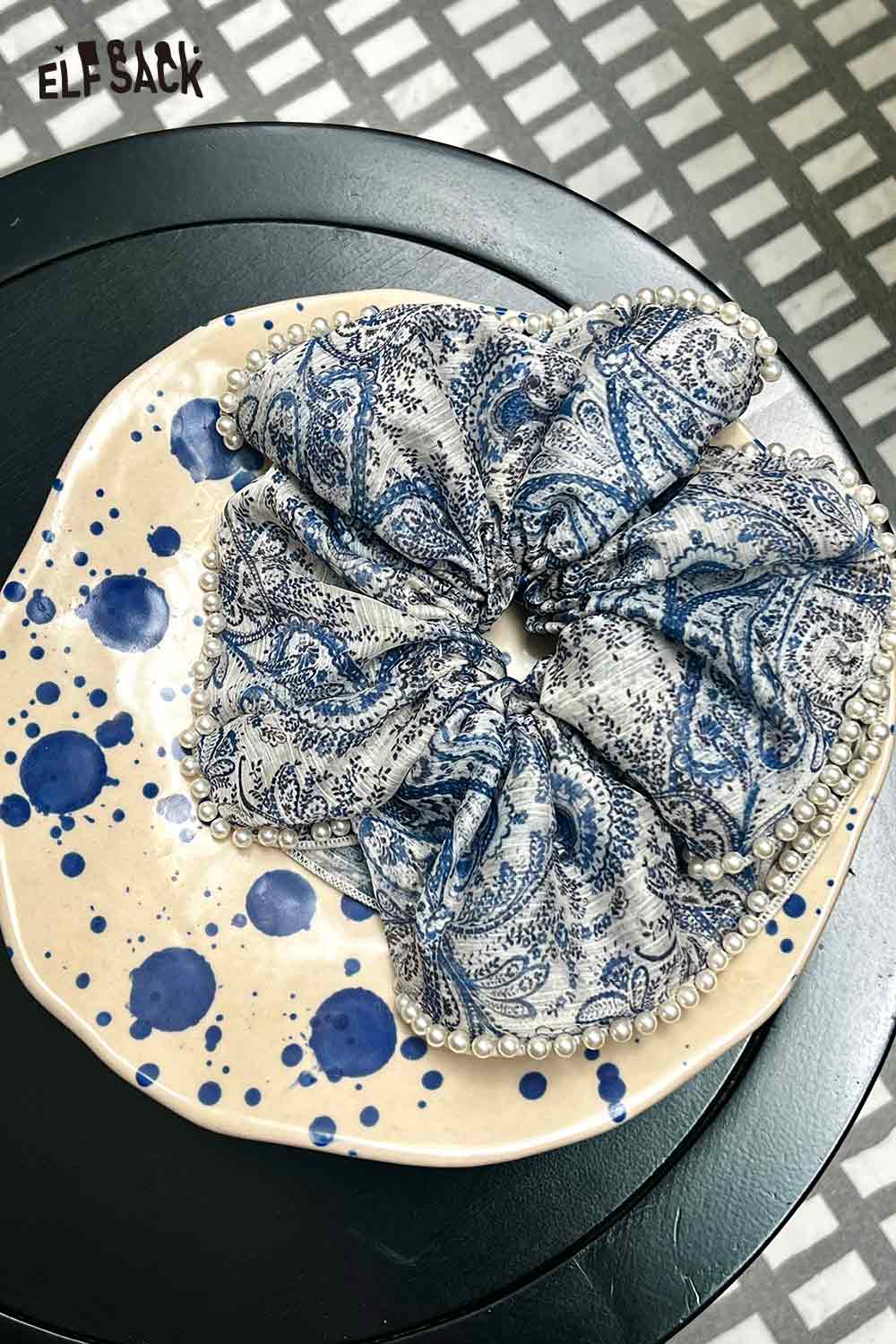 ELFSACK boho floral pearl hair band blue paisley scrunchie with pearl trim on ceramic plate