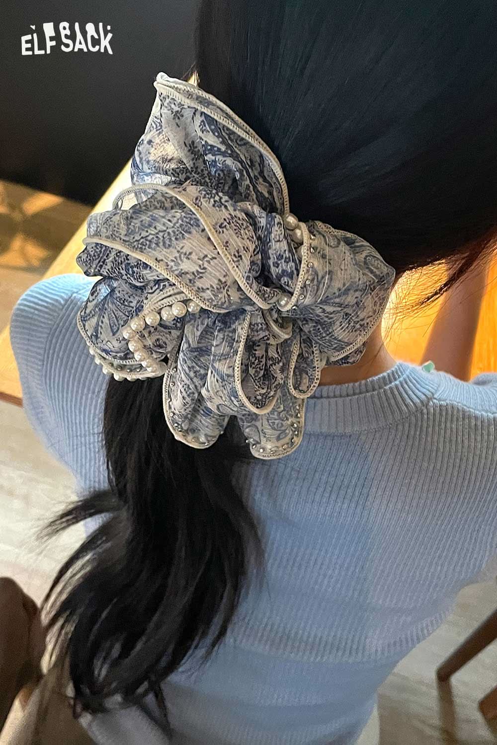 Woman wearing ELFSACK boho floral pearl hair band large blue paisley scarf scrunchie on low ponytail