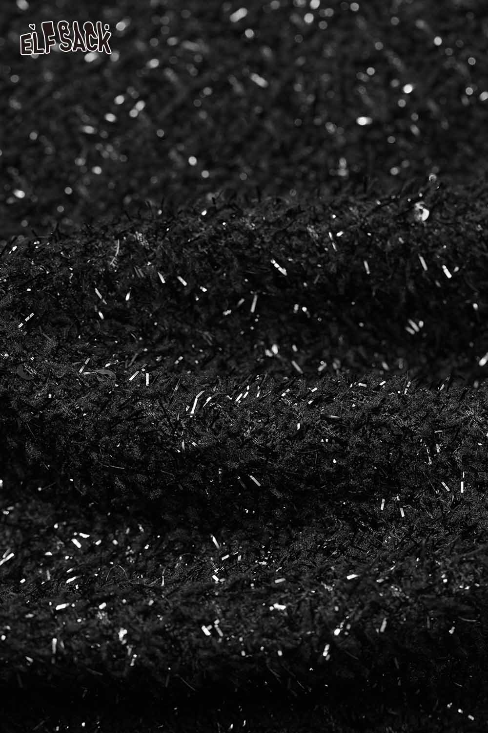 Close-up of boucle wool short blazer for women showcasing the textured black fabric
