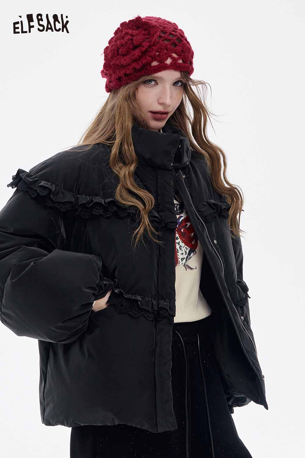 ELFSACK stylish bow graphic long sleeve tshirt layered under a trendy black puffer jacket