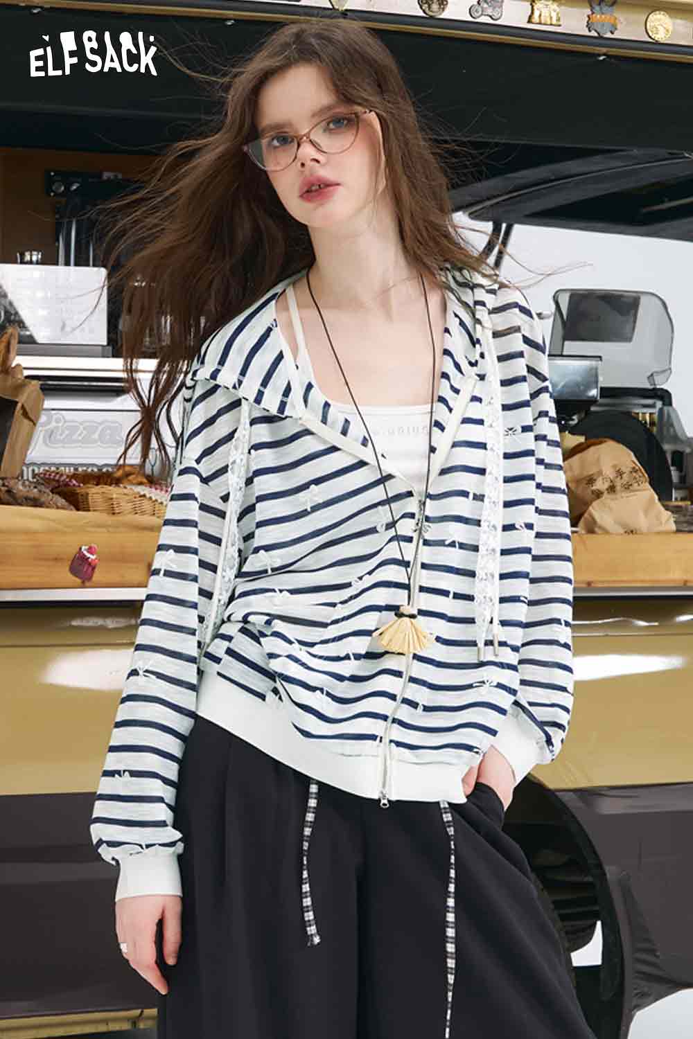 ELFSACK model wearing oversized striped cardigan for women with hood zip closure and relaxed fit