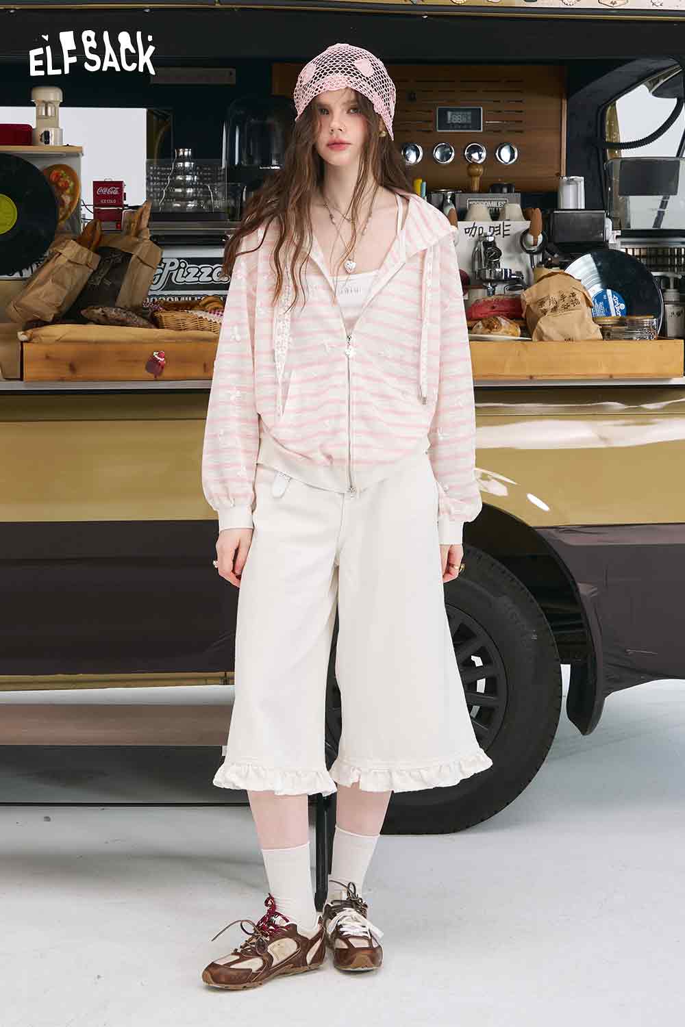 ELFSACK model wearing oversized striped cardigan for women in pink and white zip hooded knit with drawstrings