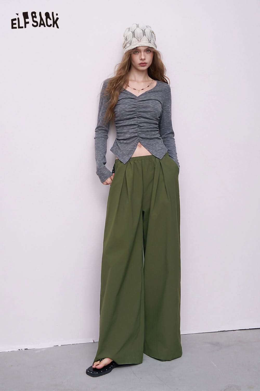 ELFSACK model wearing olive green breathable straight leg pants for women high waist pleated front