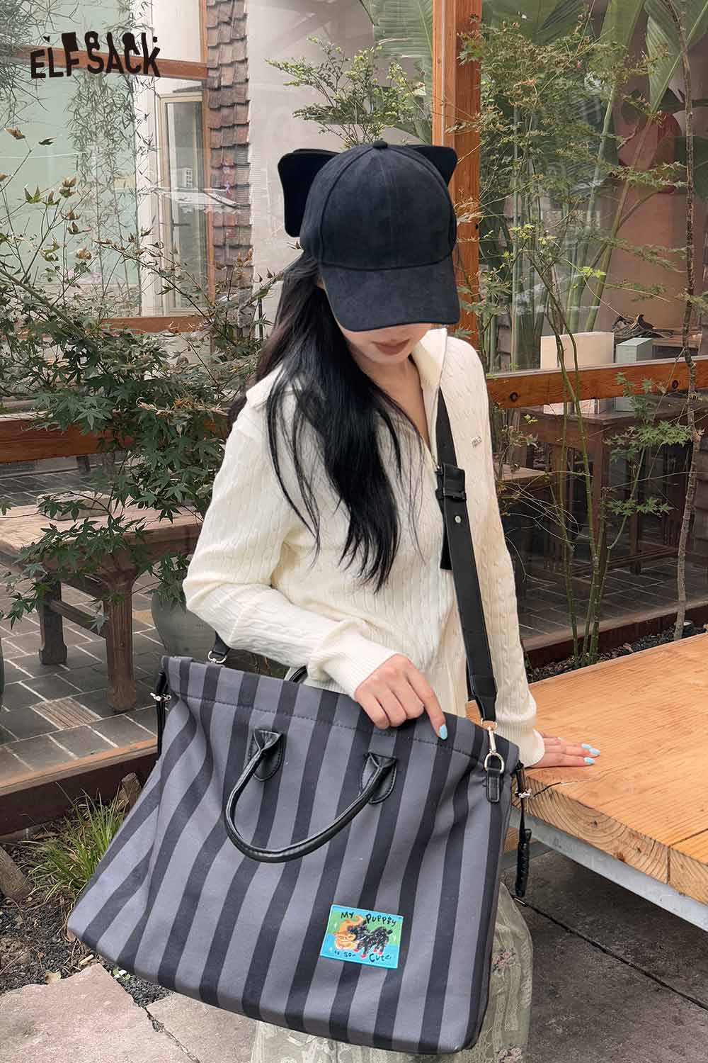 Stylish ELFSACK canvas stripe tote bag with shoulder straps and playful graphic design