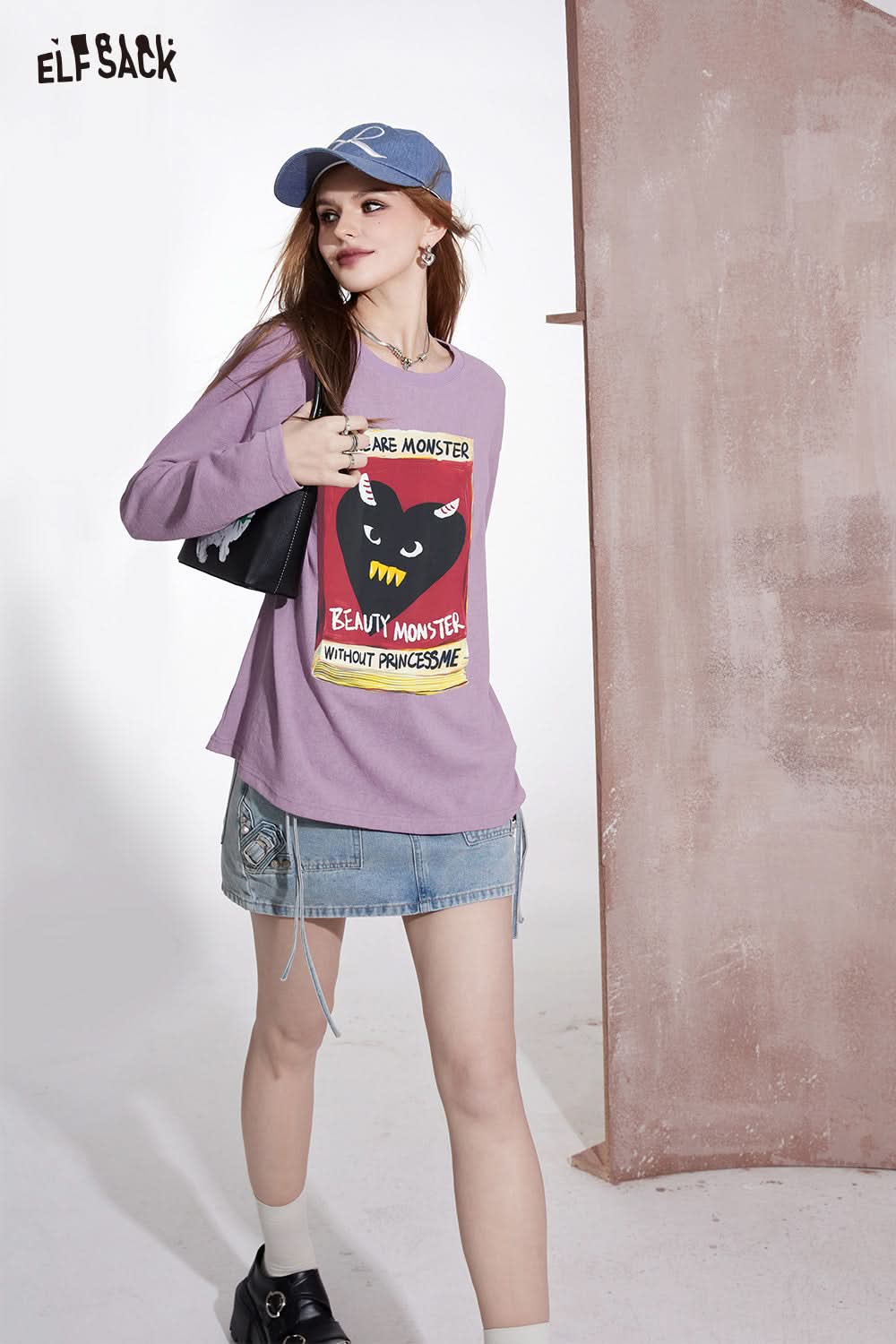 ELFSACK purple long sleeve T-shirt with colorful graphic print of a black cat and text
