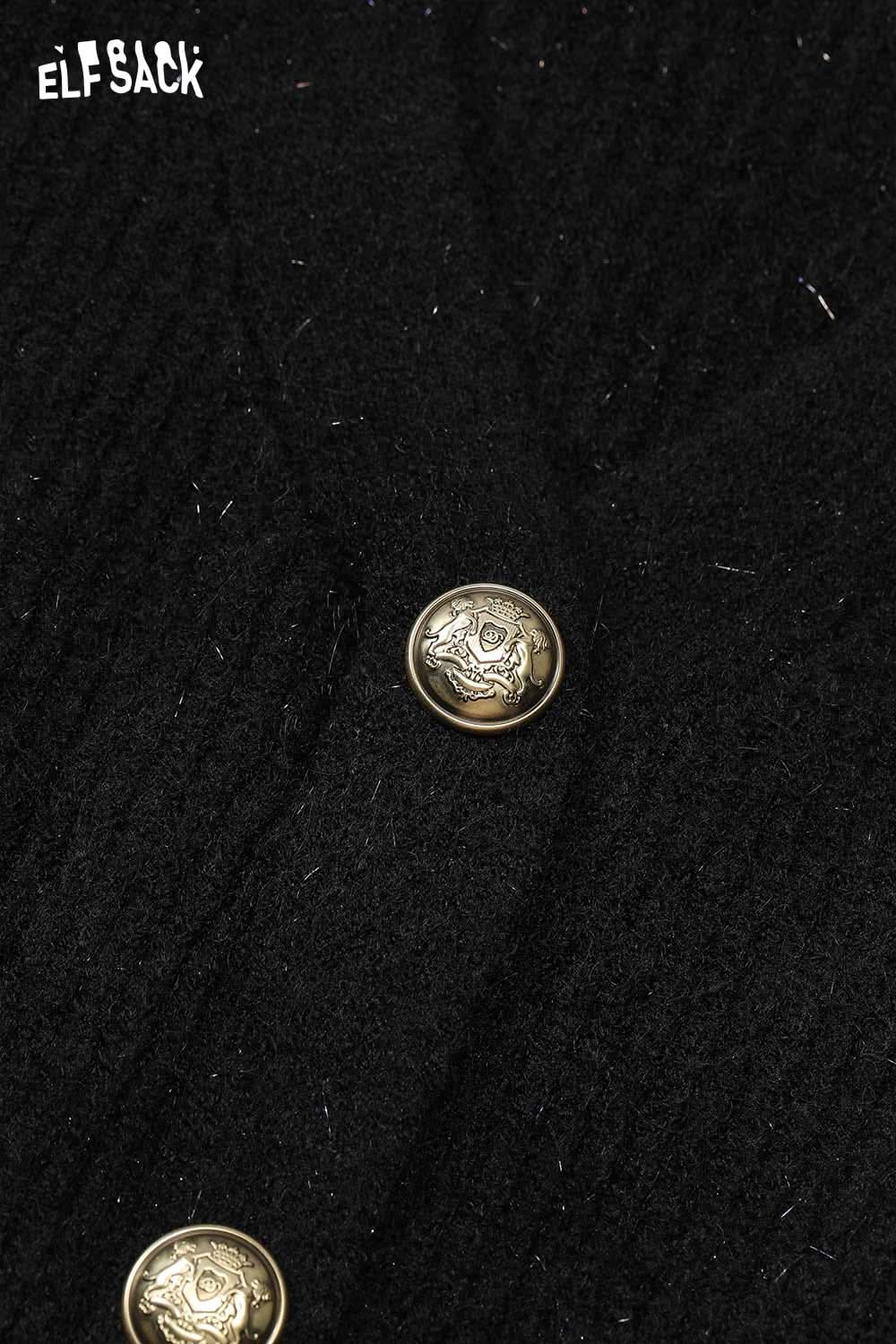 Close-up of ELFSACK cherry graphic bow tie dress showing intricate button details and textured fabric