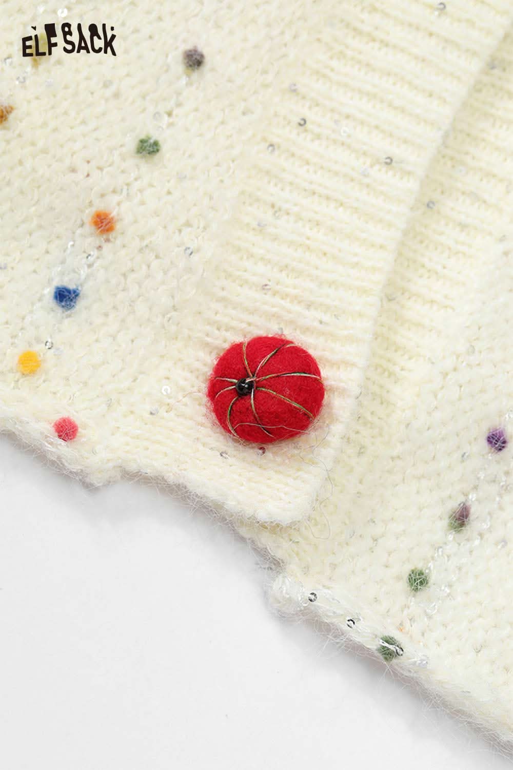ELFSACK chunky v-neck cardigan for women in soft white with colorful dot details and a red button closure