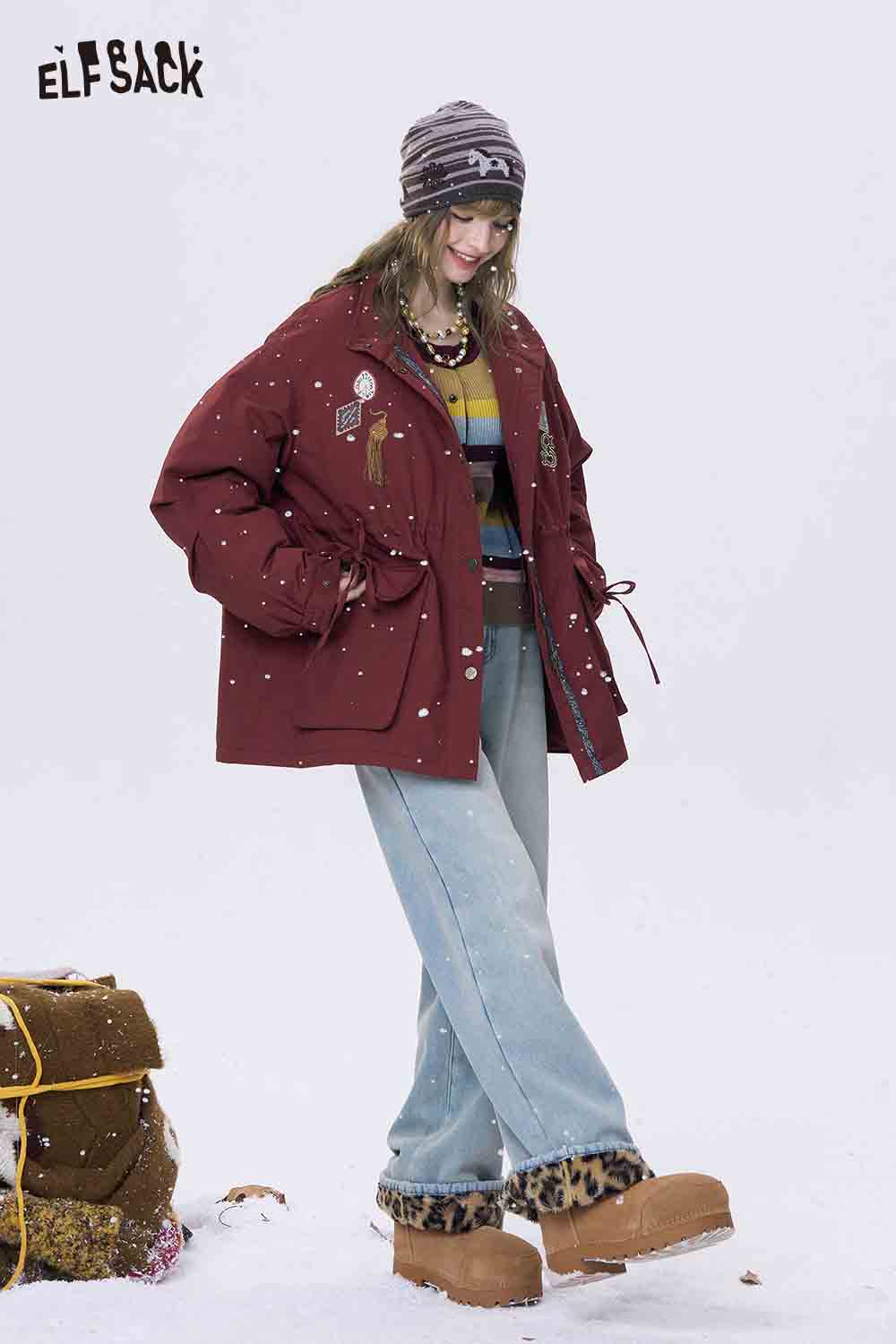 ELFSACK color block cropped knit cardigan paired with oversized jeans and winter boots in a snowy setting