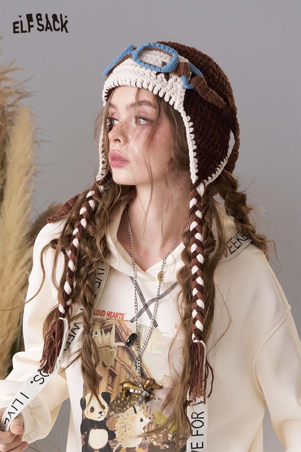 ELFSACK color blocked crocheted ear flap beanie with braided tassels for stylish winter wear