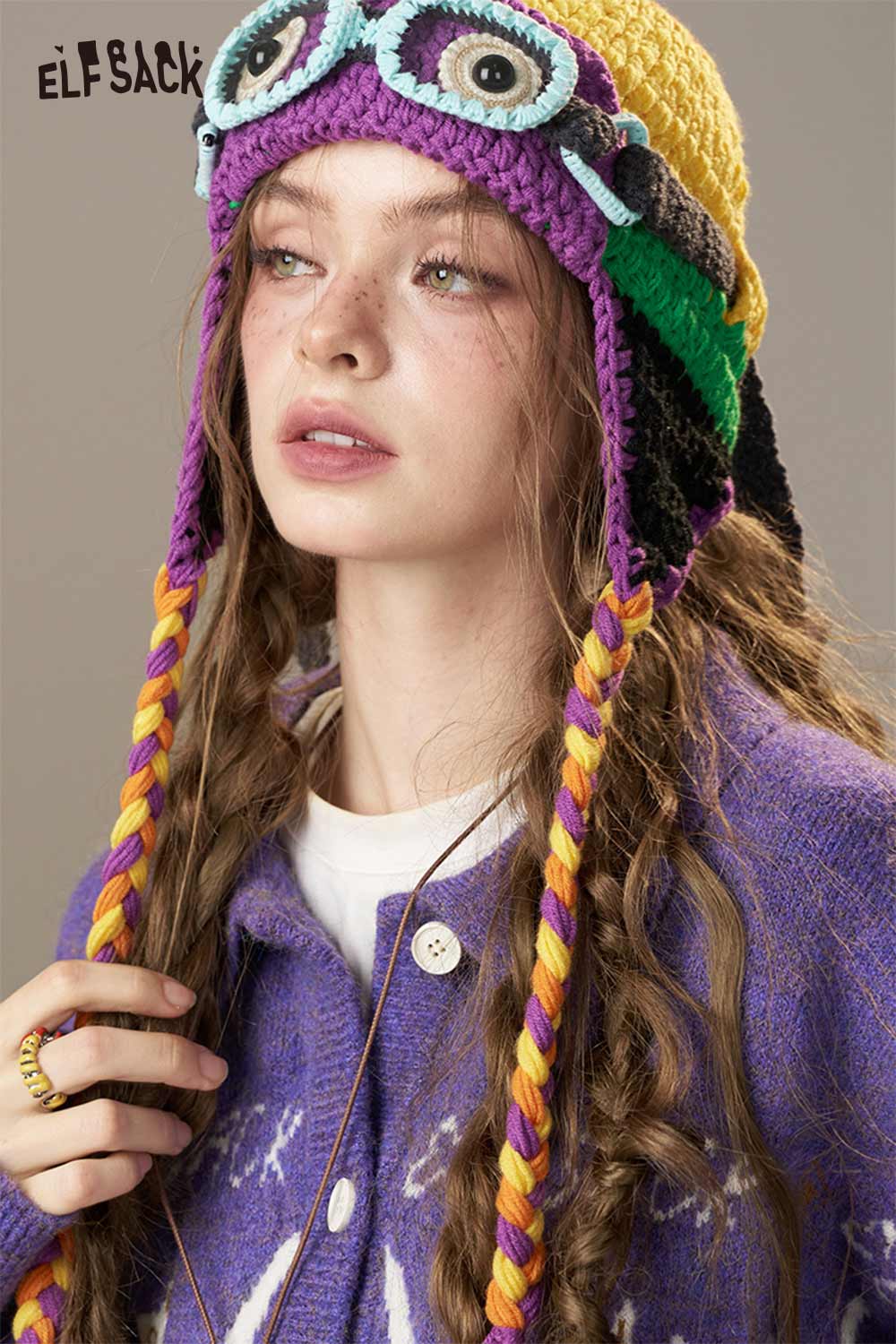 ELFSACK color blocked crocheted ear flap beanie with playful design and colorful patterns for a unique winter look
