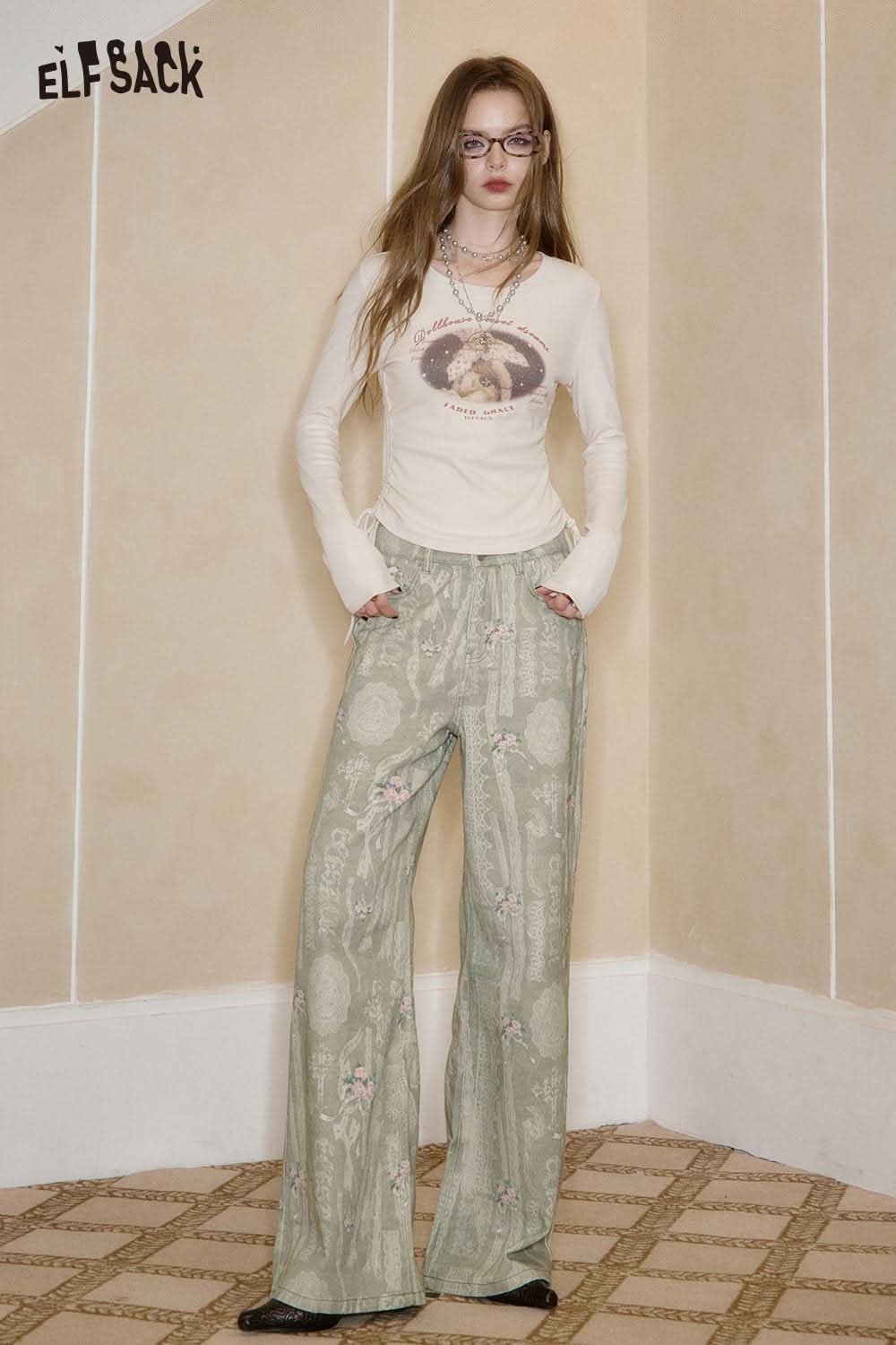 ELFSACK cotton allover print jeans for women in light green with floral patterns, styled casually
