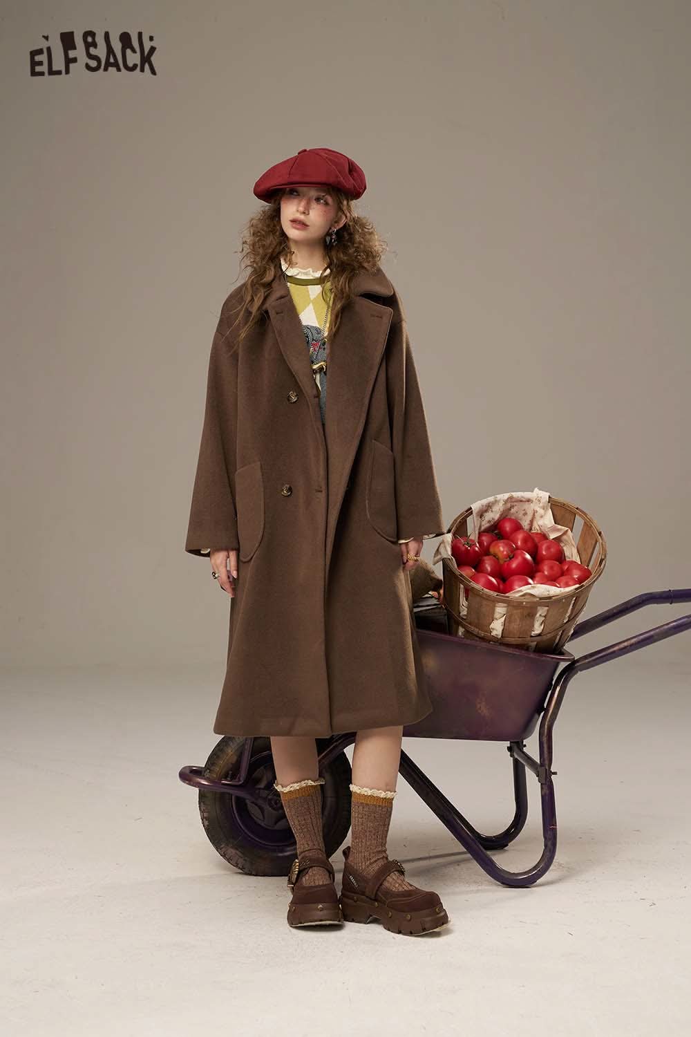 ELFSACK Canine motif embroidered dress styled with a brown coat and a stylish beret