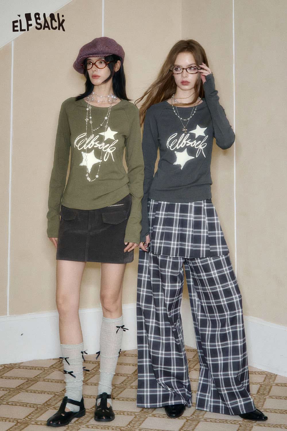 Two models wearing ELFSACK clothing, showcasing the constellation stitch slim fit tee in stylish outfits