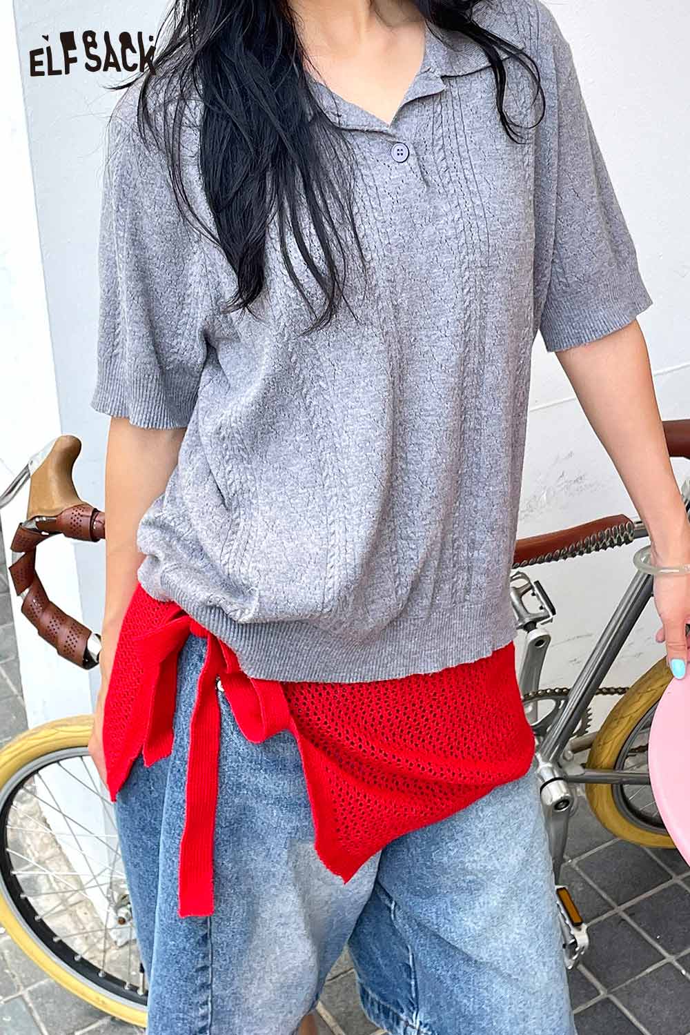 Stylish gray top paired with a cotton blend knit skirt with apron for a trendy casual look