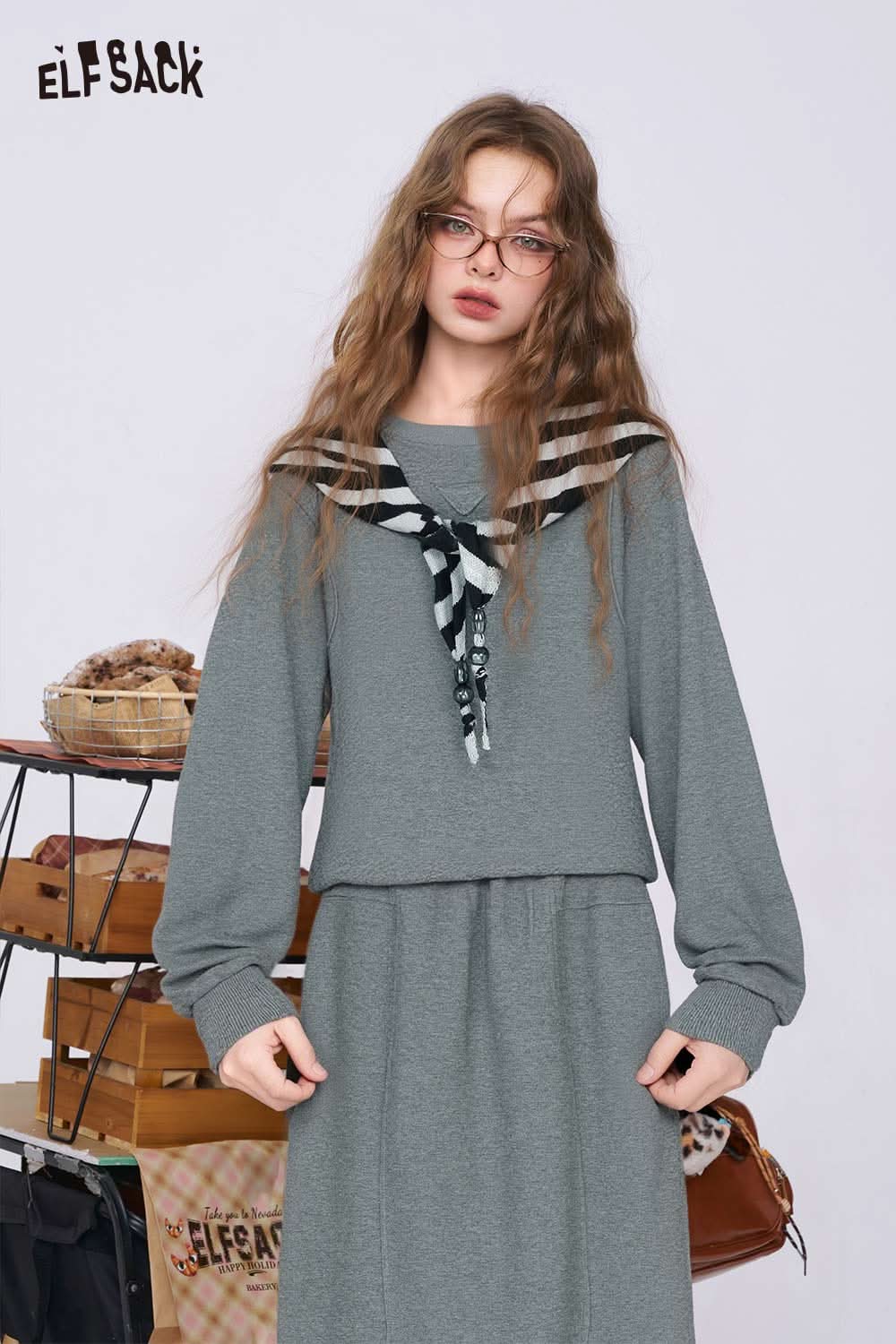 ELFSACK cotton blend two-piece set for women featuring a stylish sweater and matching skirt