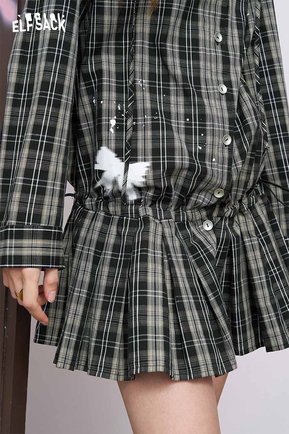 ELFSACK women's plaid shirt dress close up of green black plaid fabric with white paint splatter and pleated skirt