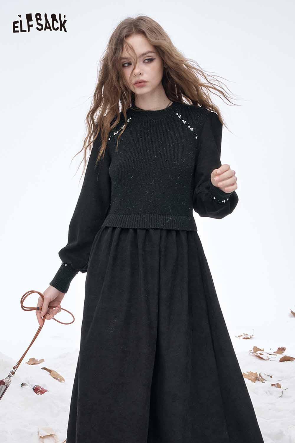 ELFSACK crystal accent midi dress with a stylish sweater top and flowing black skirt in a winter setting