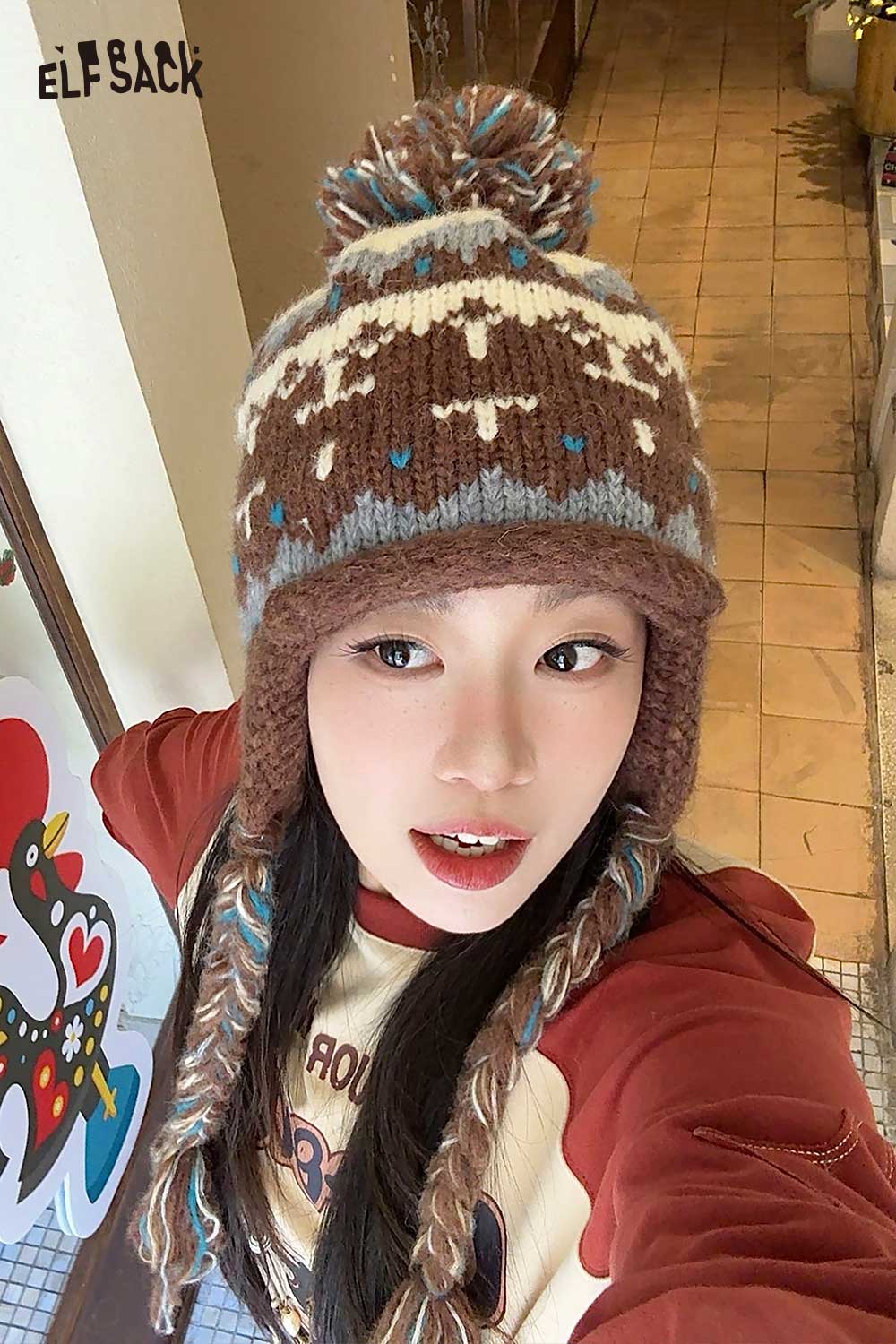 Cute Fair Isle knit beanie from ELFSACK with a playful pom-pom and colorful design