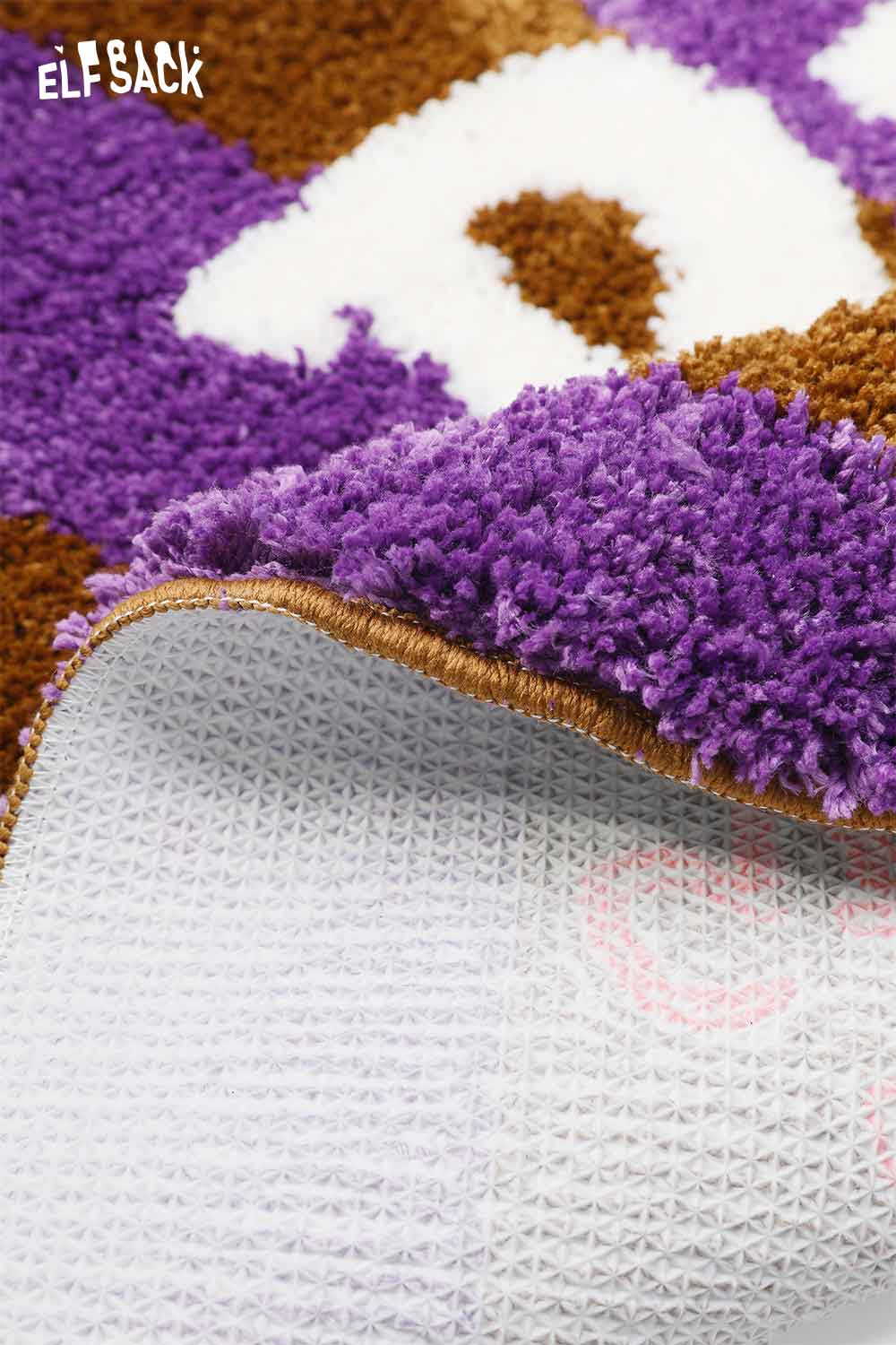 Close-up of ELFSACK cute round striped rug showing texture and backing details