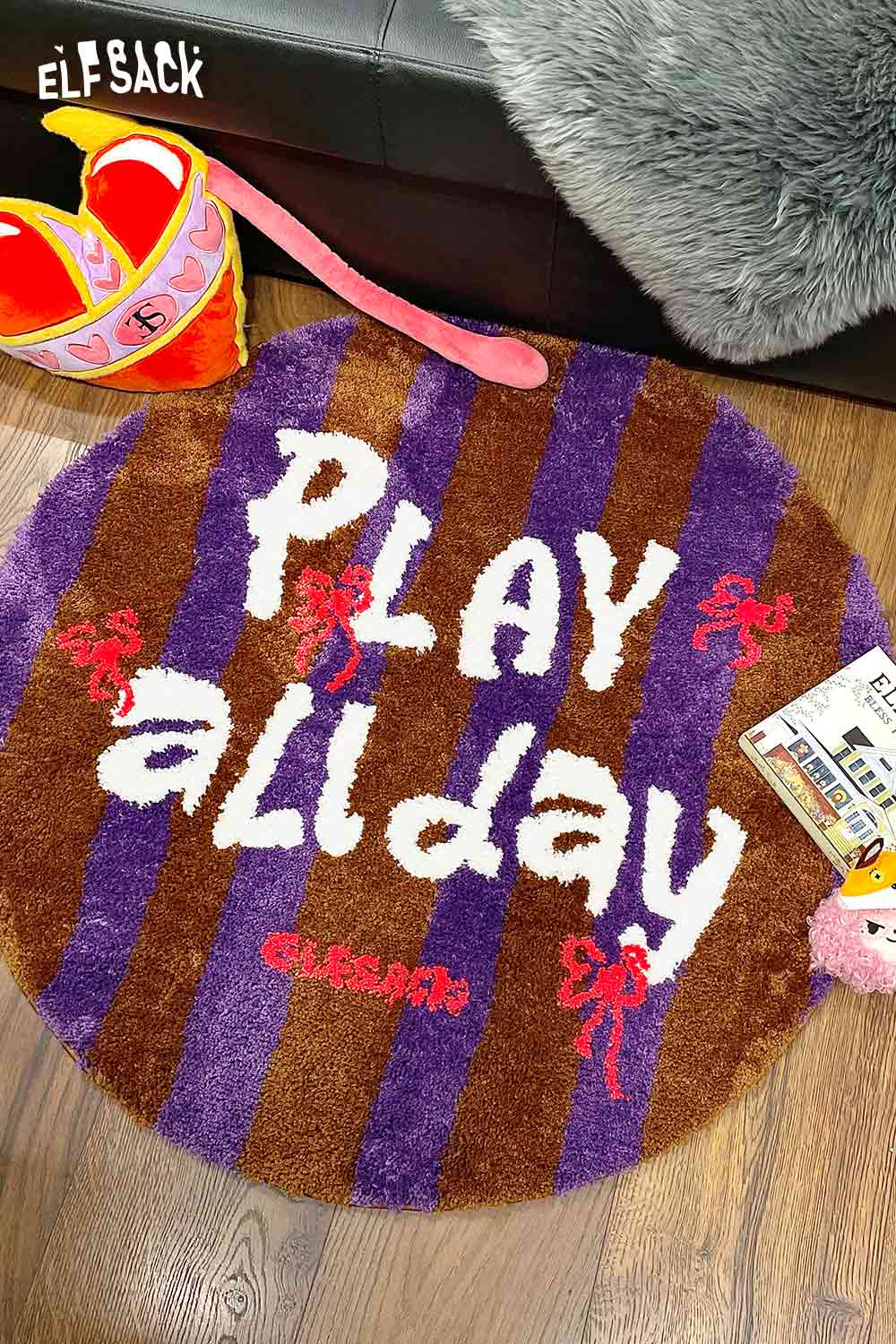 Cute round striped rug in purple and brown with playful 'PLAY allday' text for a fun decor touch