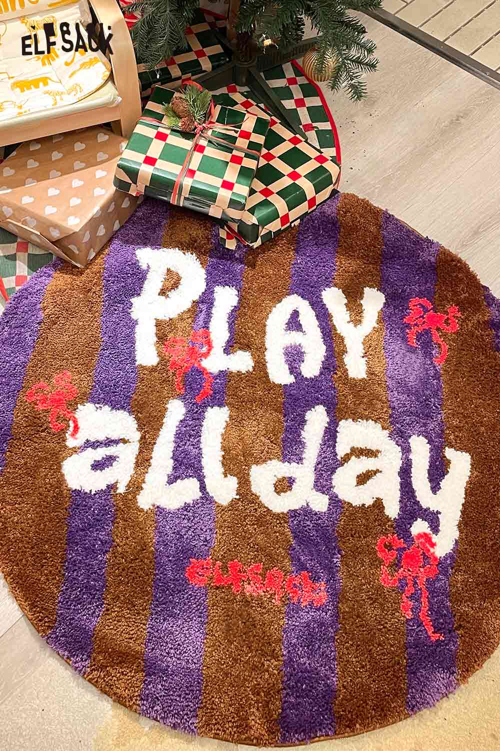 Cute round striped rug featuring 'PLAY all day' text in vibrant colors for playful decor
