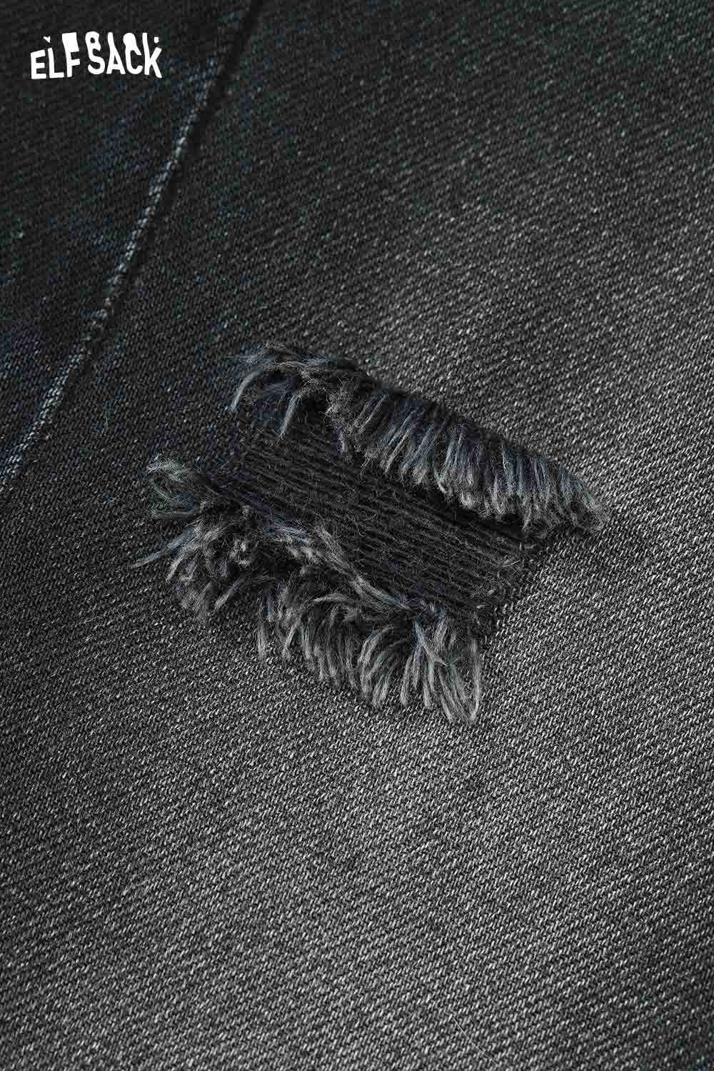 Close-up of ELFSACK deer patchwork wide leg jeans showcasing distressed detailing and unique design