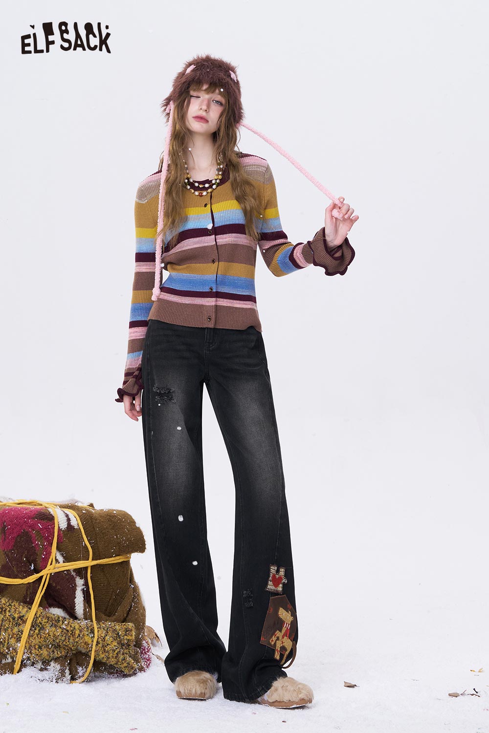 Fashionable ELFSACK deer patchwork wide leg jeans styled with a striped cardigan and unique accessories