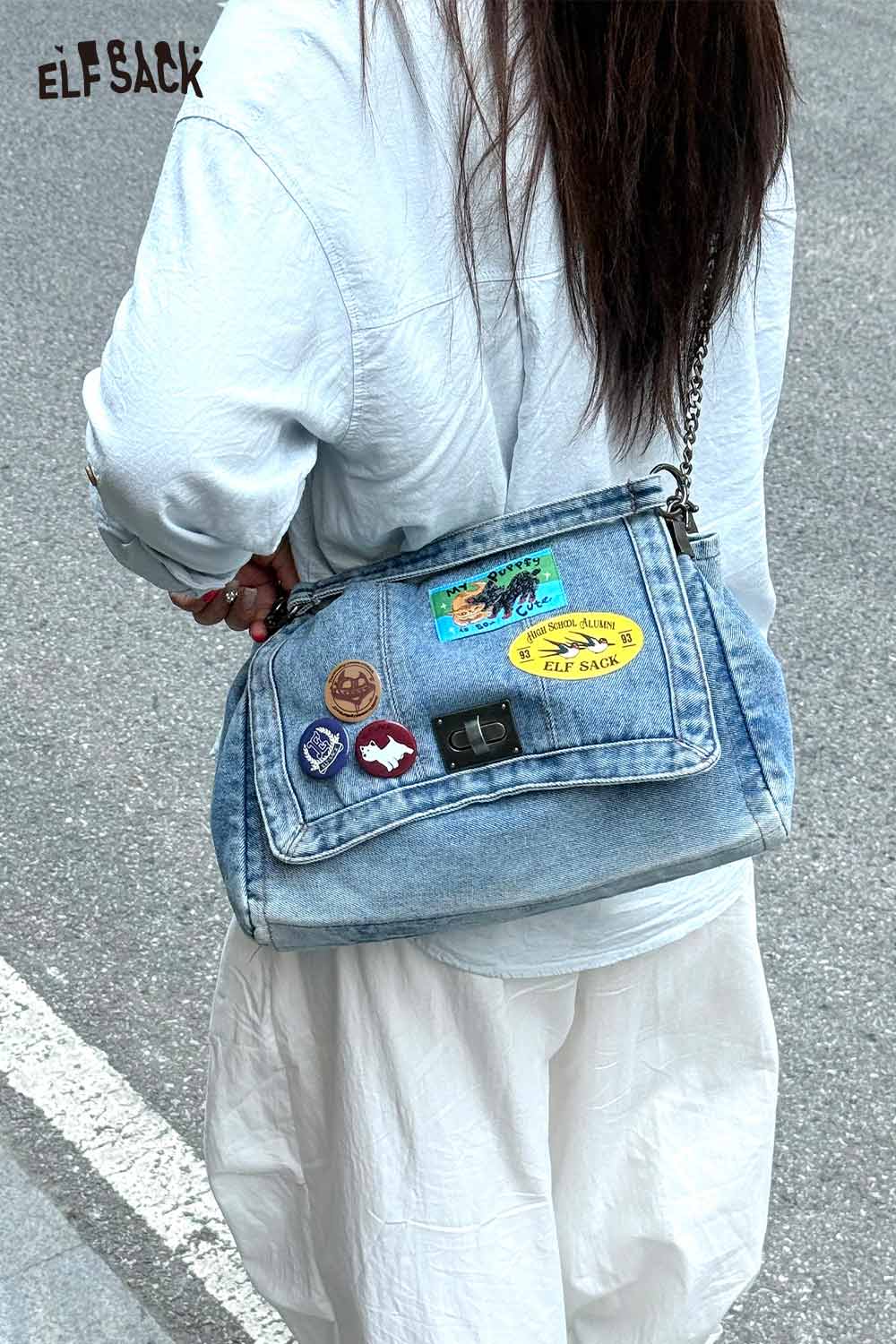 Denim messenger bag for women featuring colorful patches and a stylish chain strap