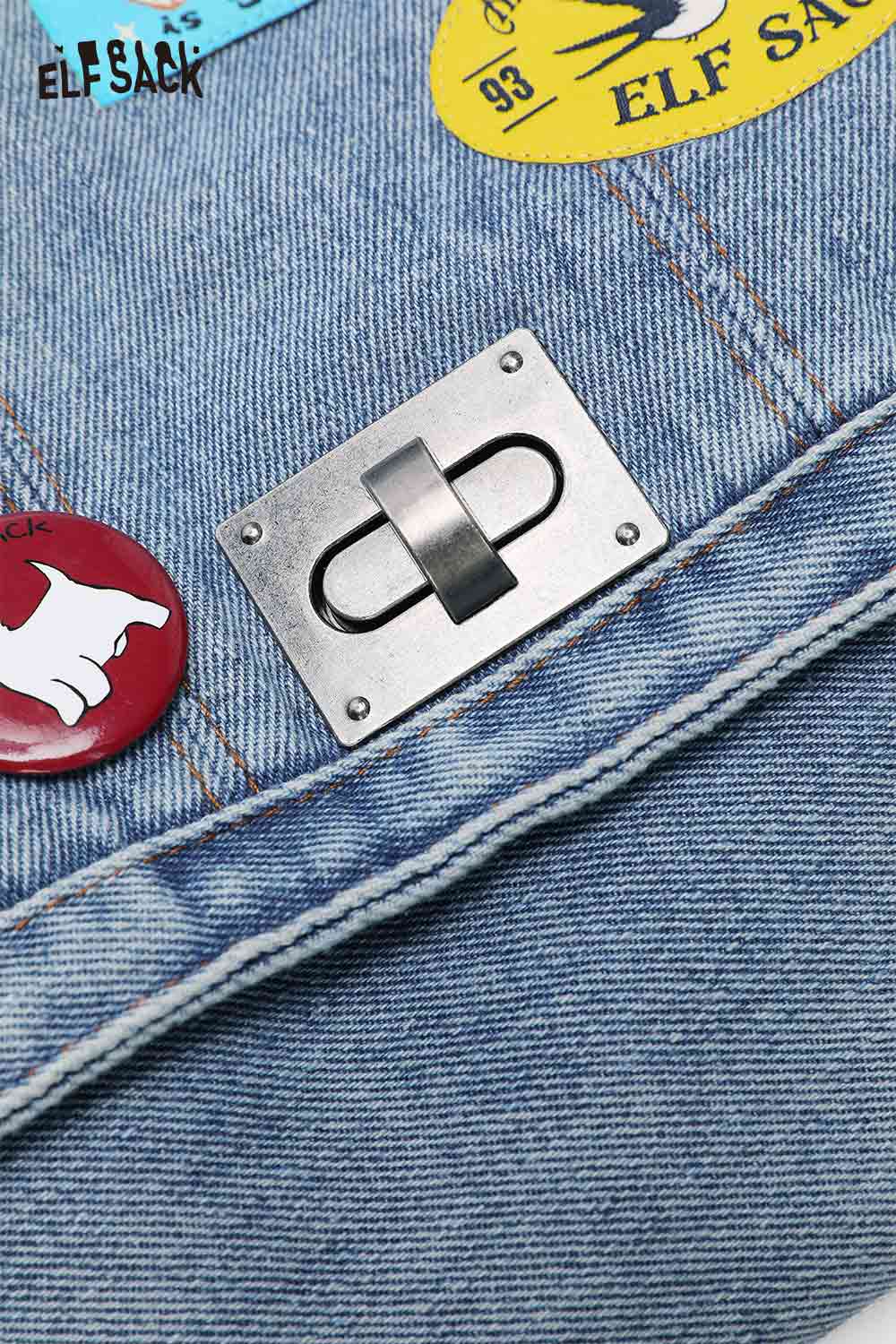 Close-up of ELFSACK denim messenger bag for women with playful patches and metallic clasp detail