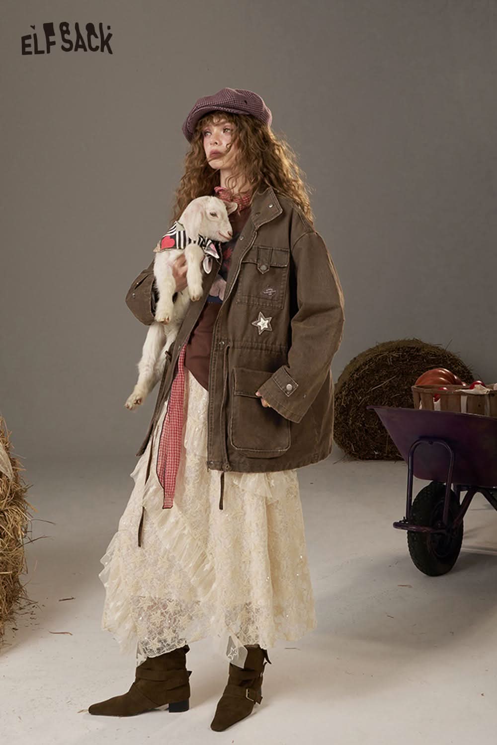 ELFSACK women's loose denim jacket styled with a layered outfit and holding a cute goat