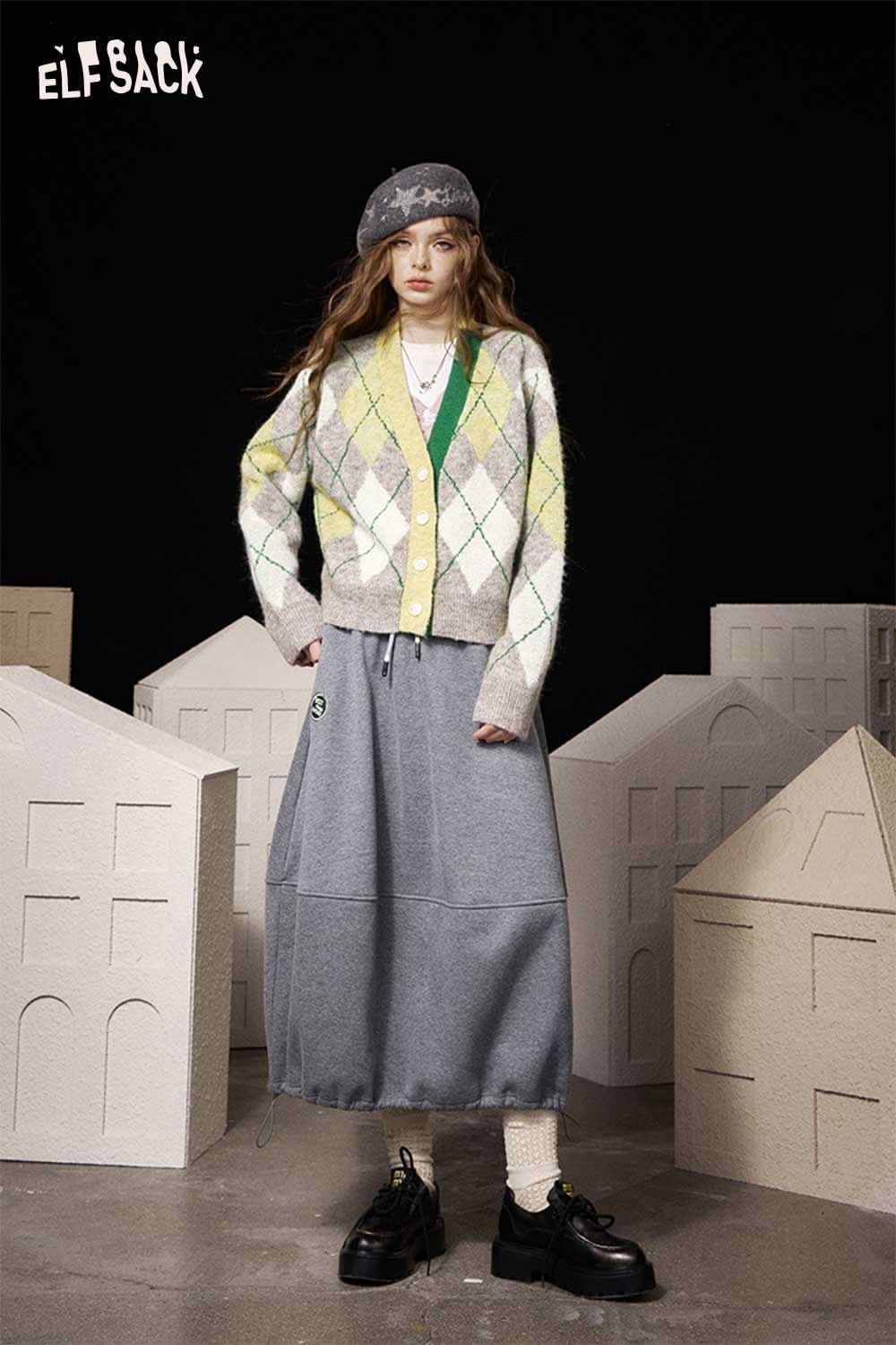 ELFSACK diamond pattern v neck sweater in pastel colors paired with a gray maxi skirt